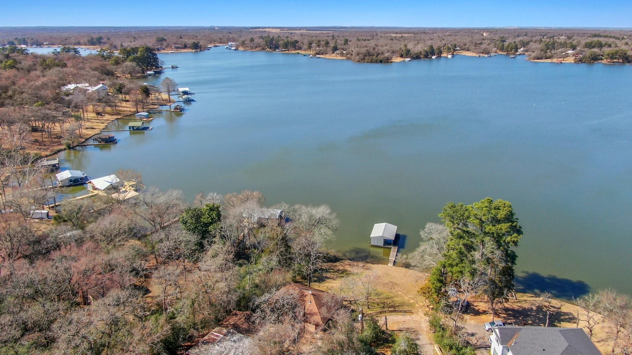 Image 3: This photo showcases a serene lakefront property w