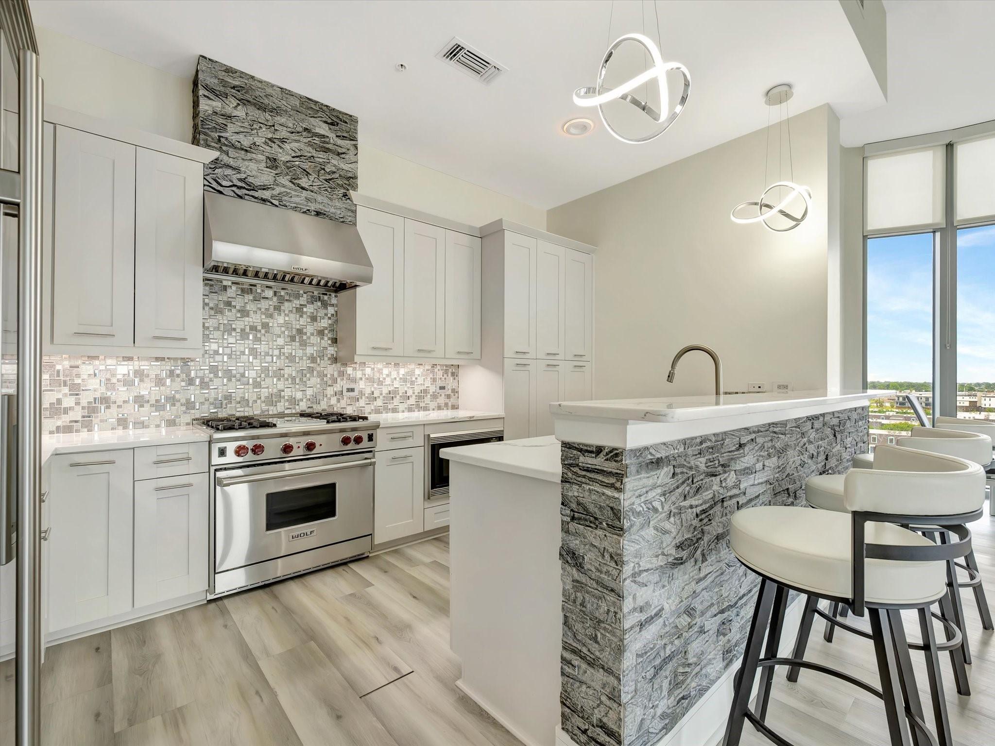 Image 1: Gorgeous kitchen with custom stacked stone bar and