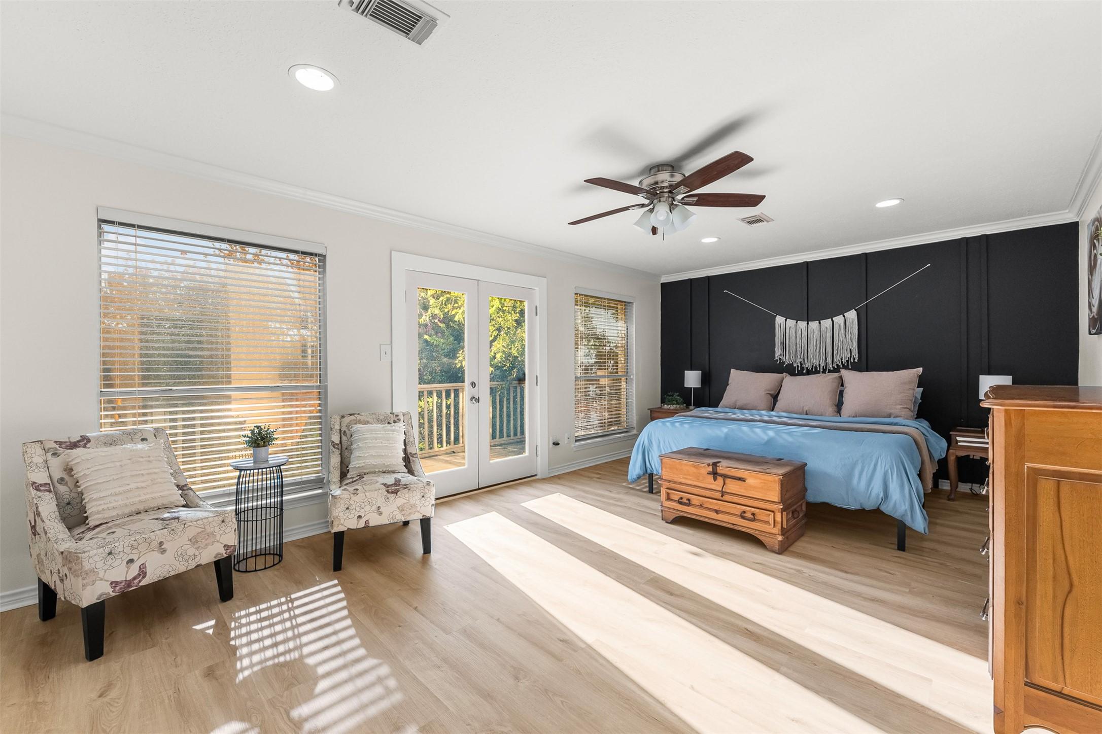 Image 3: Primary Suite upstairs with sitting area and frenc