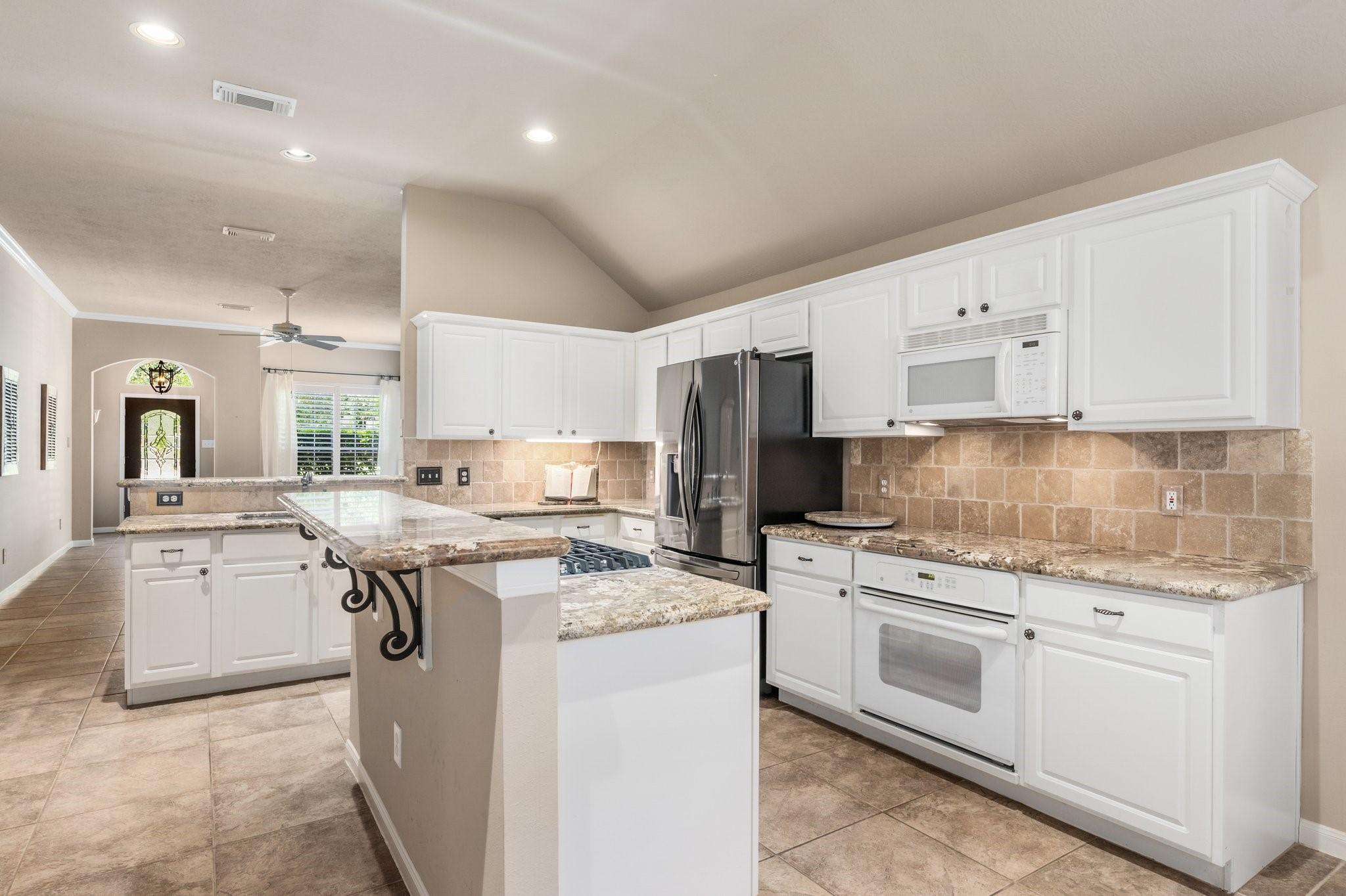 Image 3: Plenty of cabinetry for storage and countertop spa