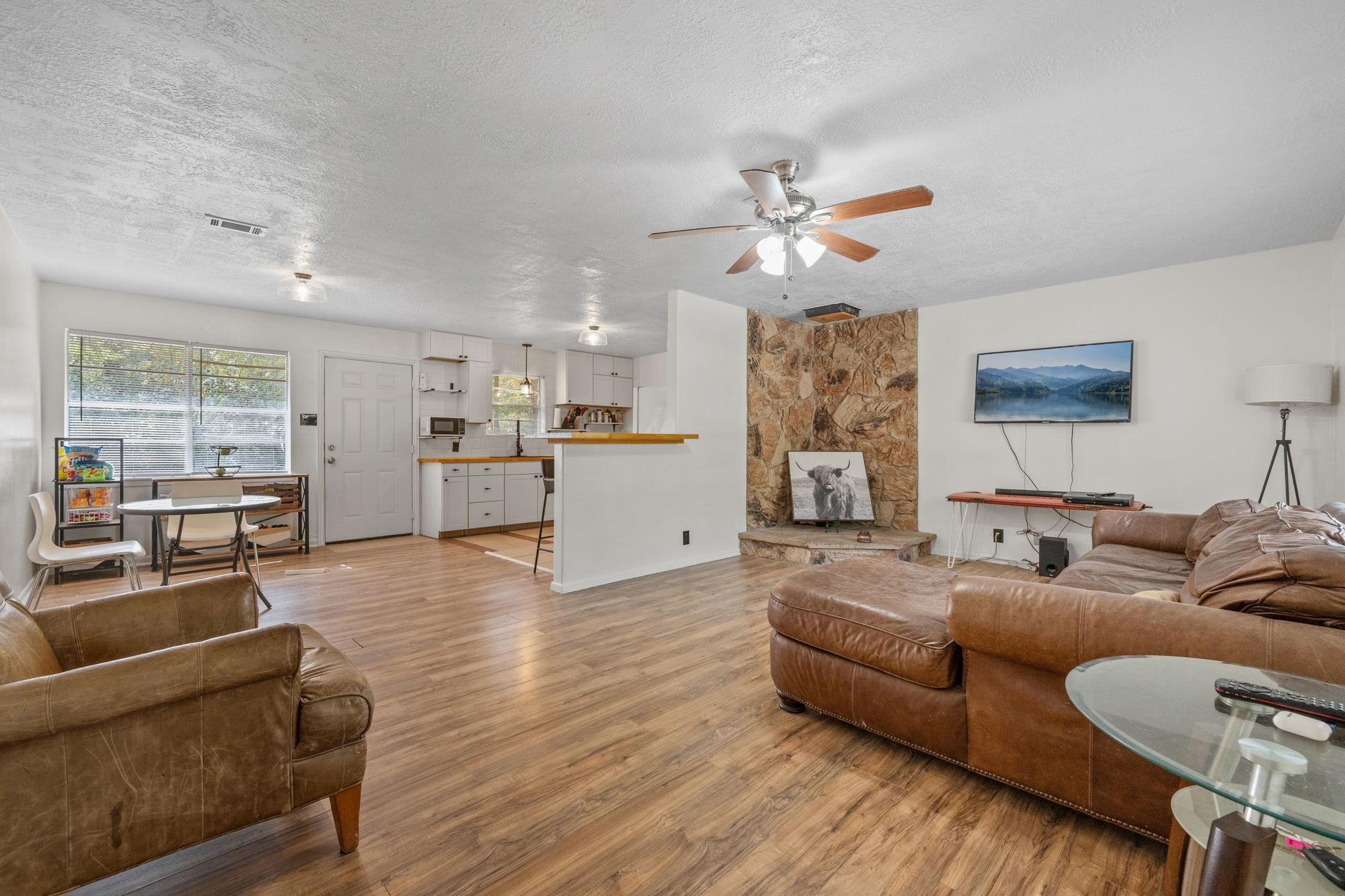 Image 4: Entry begins with a spacious family room.  Large w