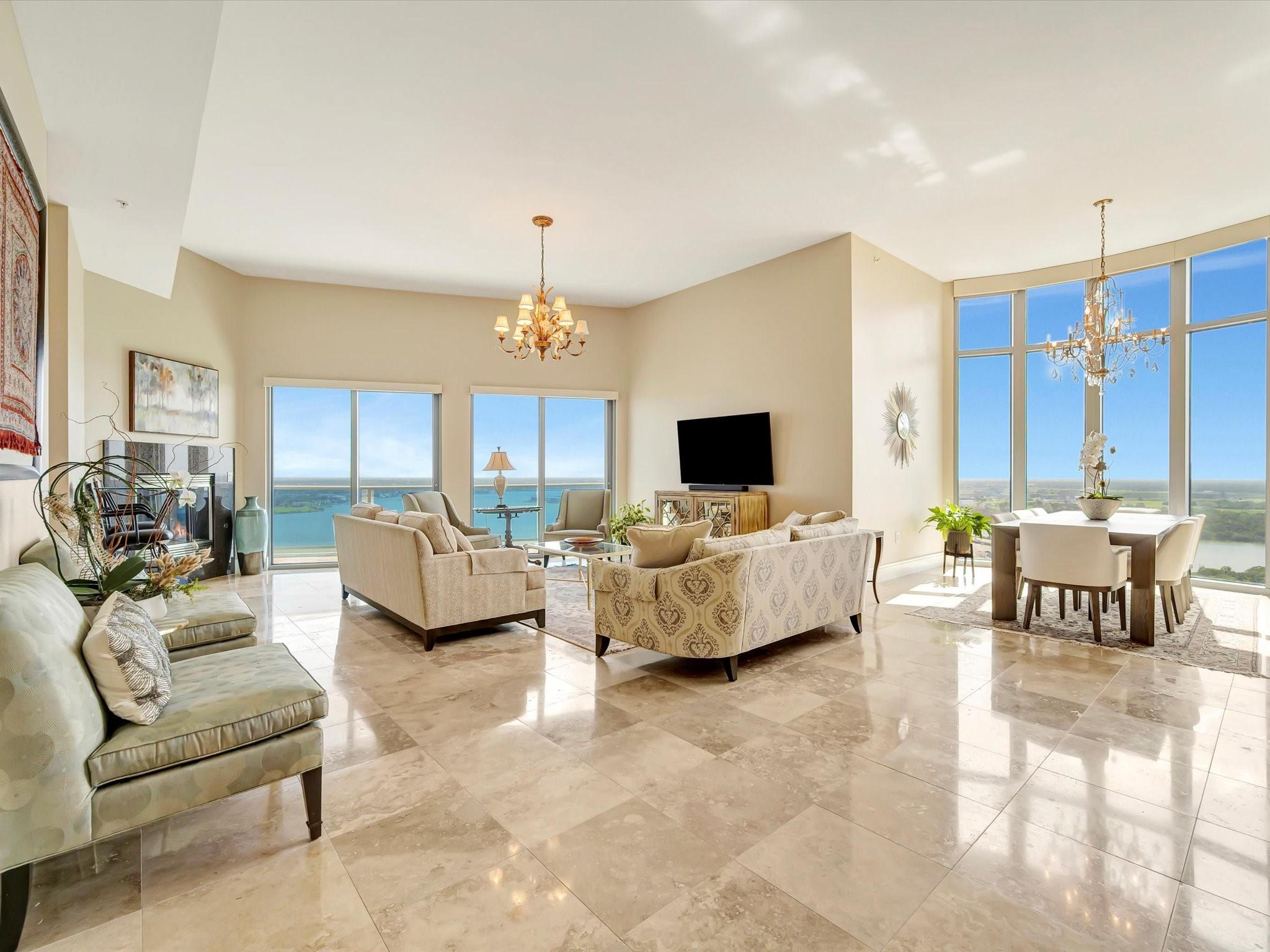 Image 3: Spacious open-concept living and dining area with
