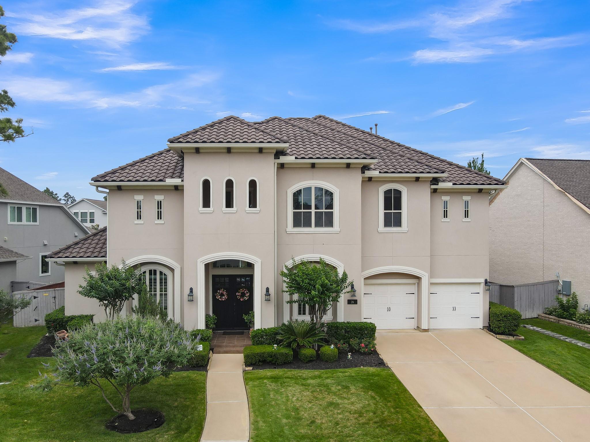 Image 1: This beautiful two-story home features a stucco ex