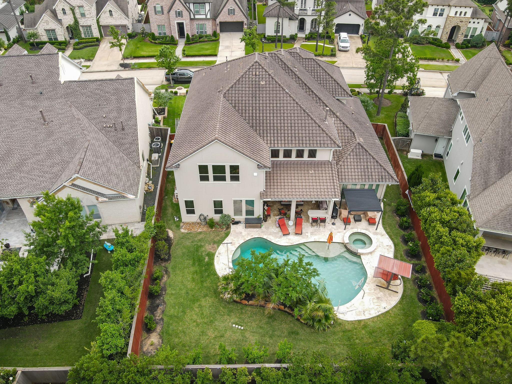 Image 3: This aerial view showcases a spacious two-story ho