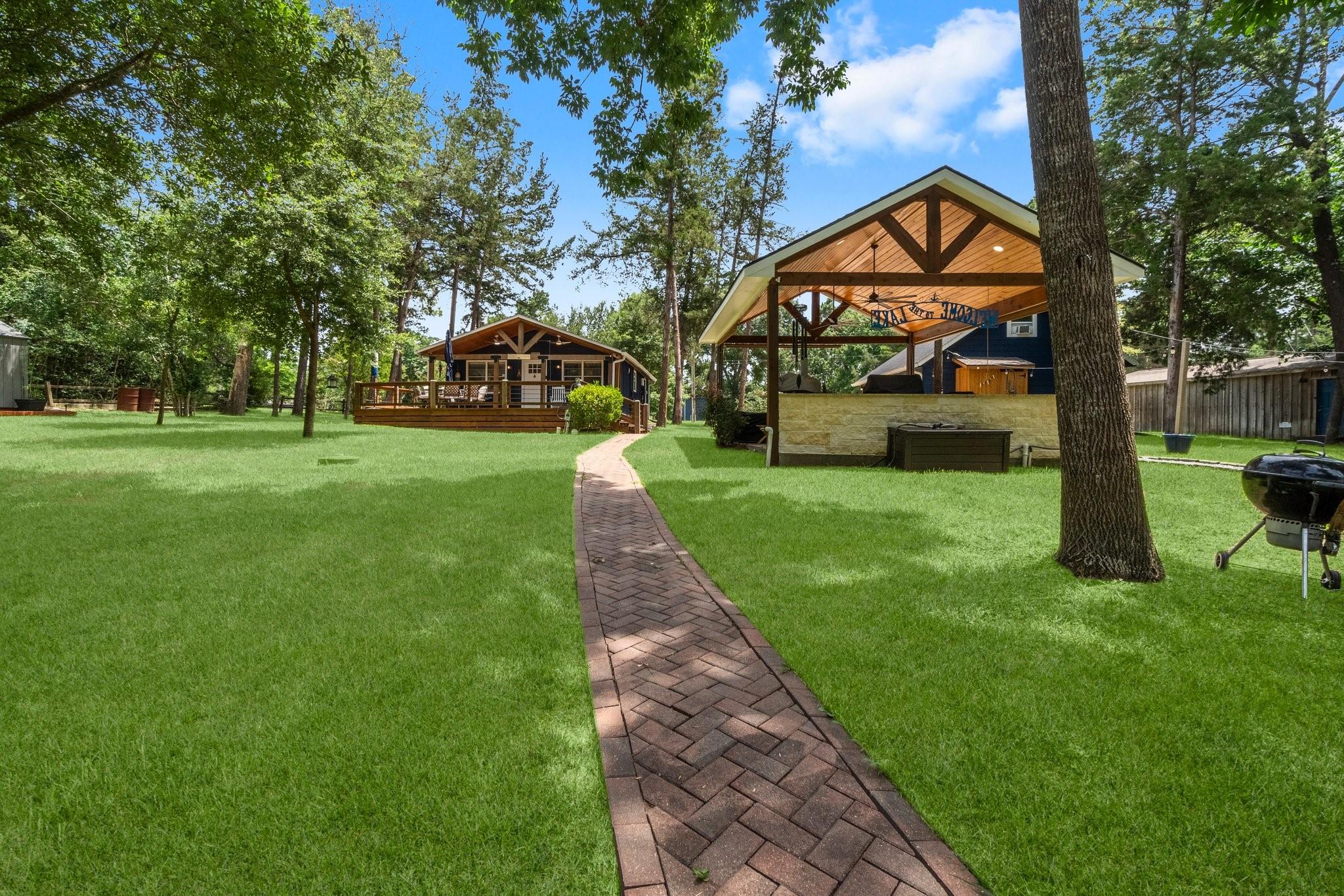 Image 1: Spacious wooden deck with comfortable seating area