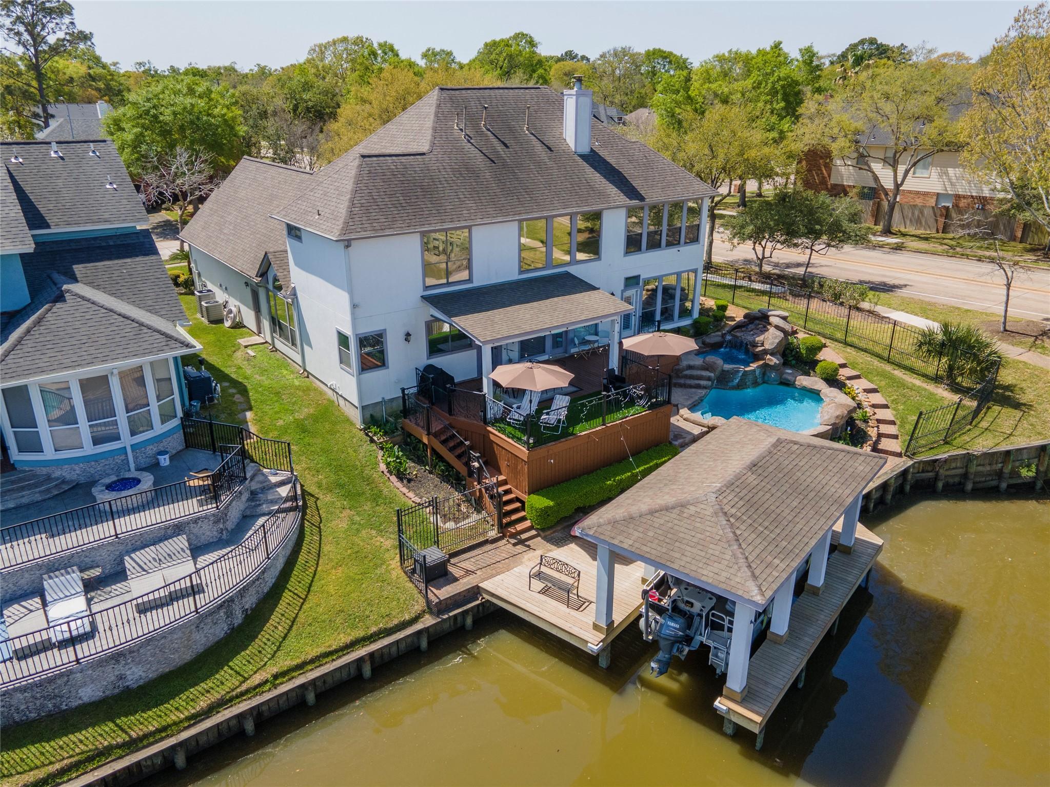 Image 3: Property includes a boathouse with lift