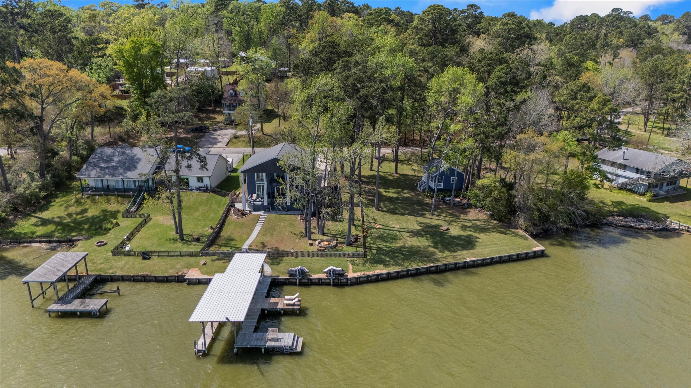 Image 1: Discover a tranquil lakeside retreat with lush gre
