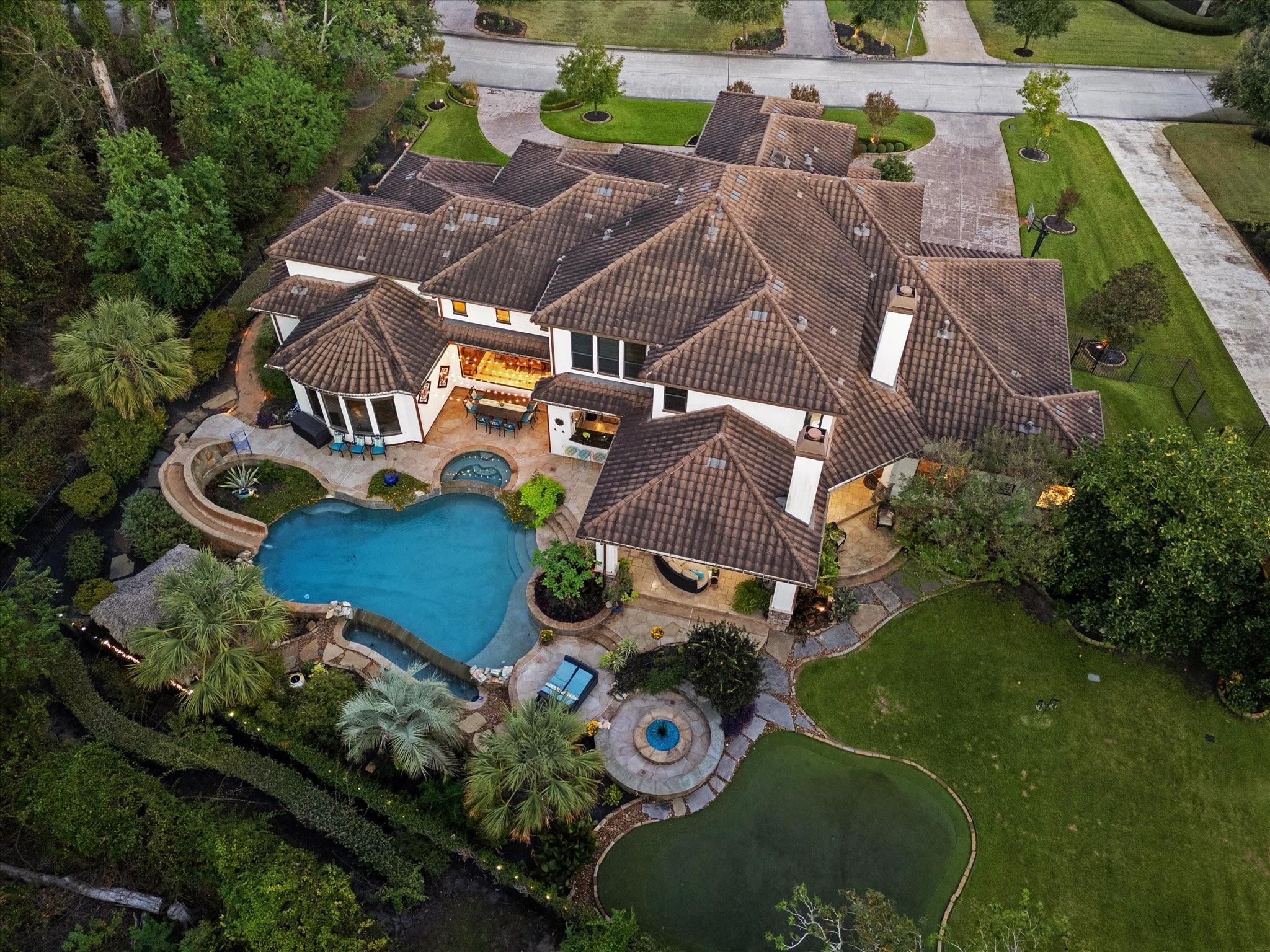 Image 2: This is an aerial view of a luxurious, spacious ho