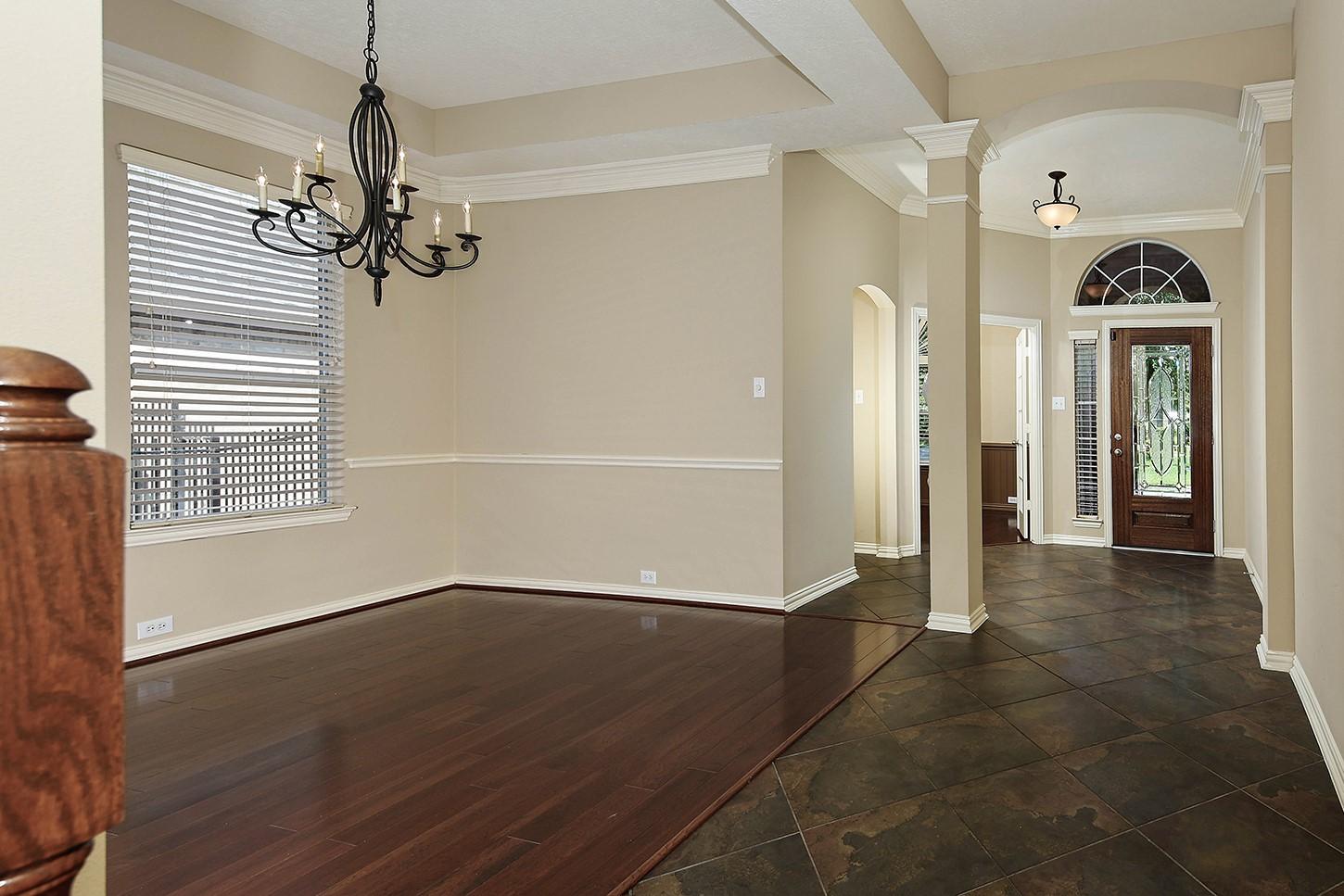Image 4: Extensive Tile and Wood Flooring on the Main Floor