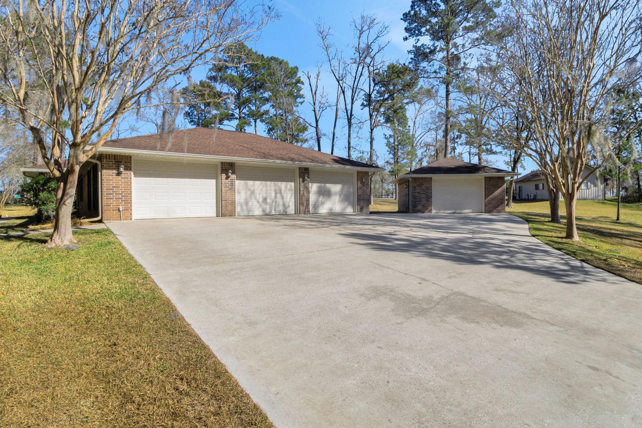 Image 3: The home has an oversized THREE car garage plus a