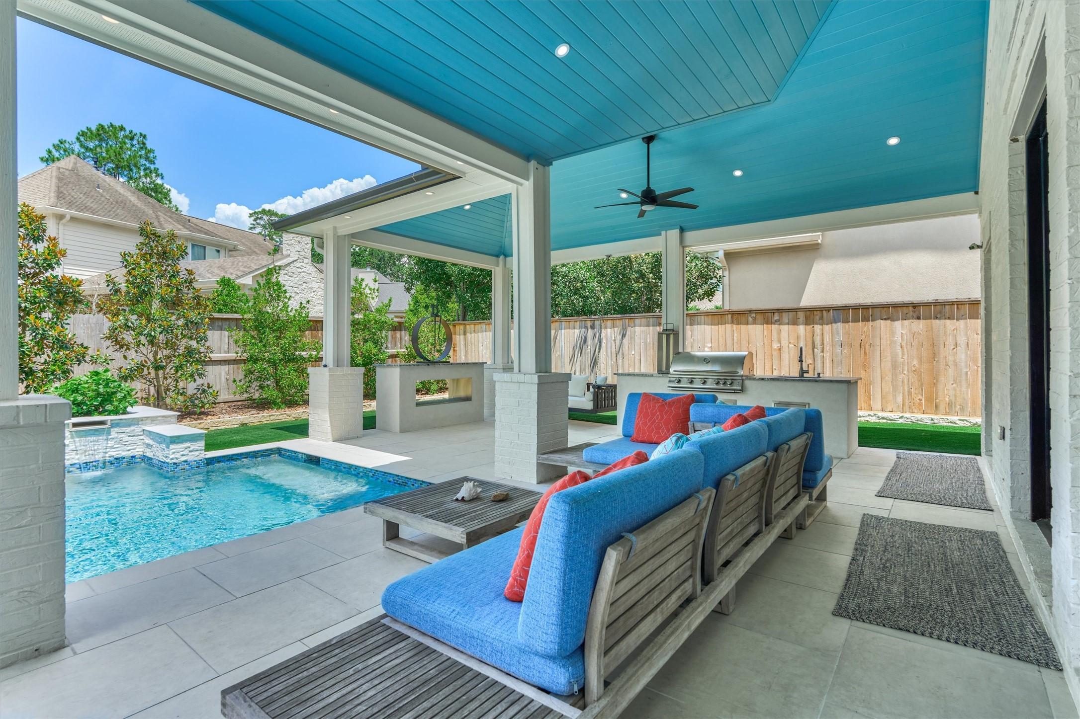 Image 3: The extensive covered patio area features a summer