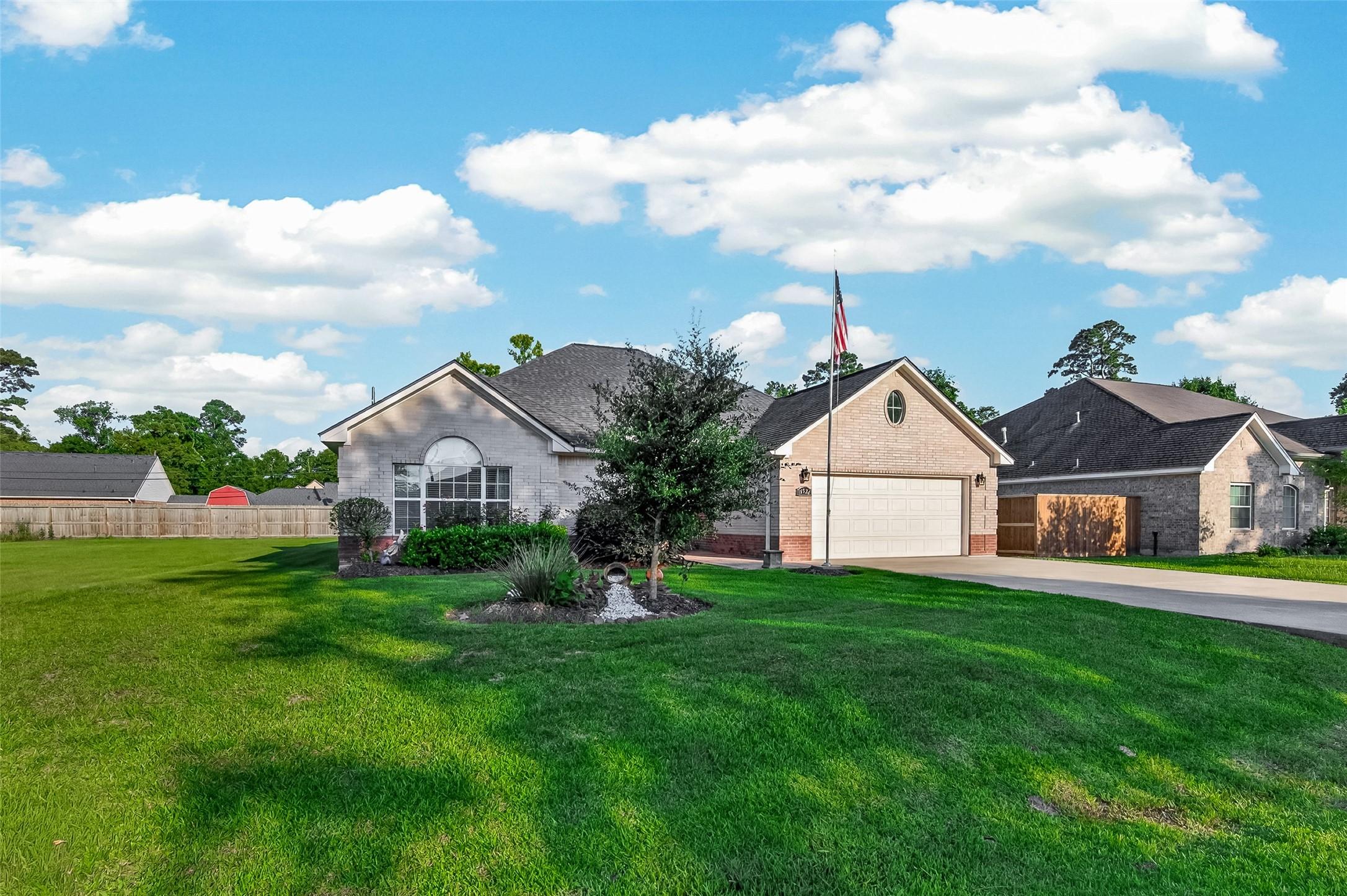 Image 2: This photo shows a charming single-story brick hom