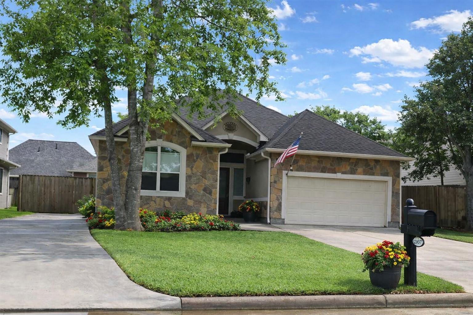 Image 2: Elevation (Virtually Staged landscaping)
