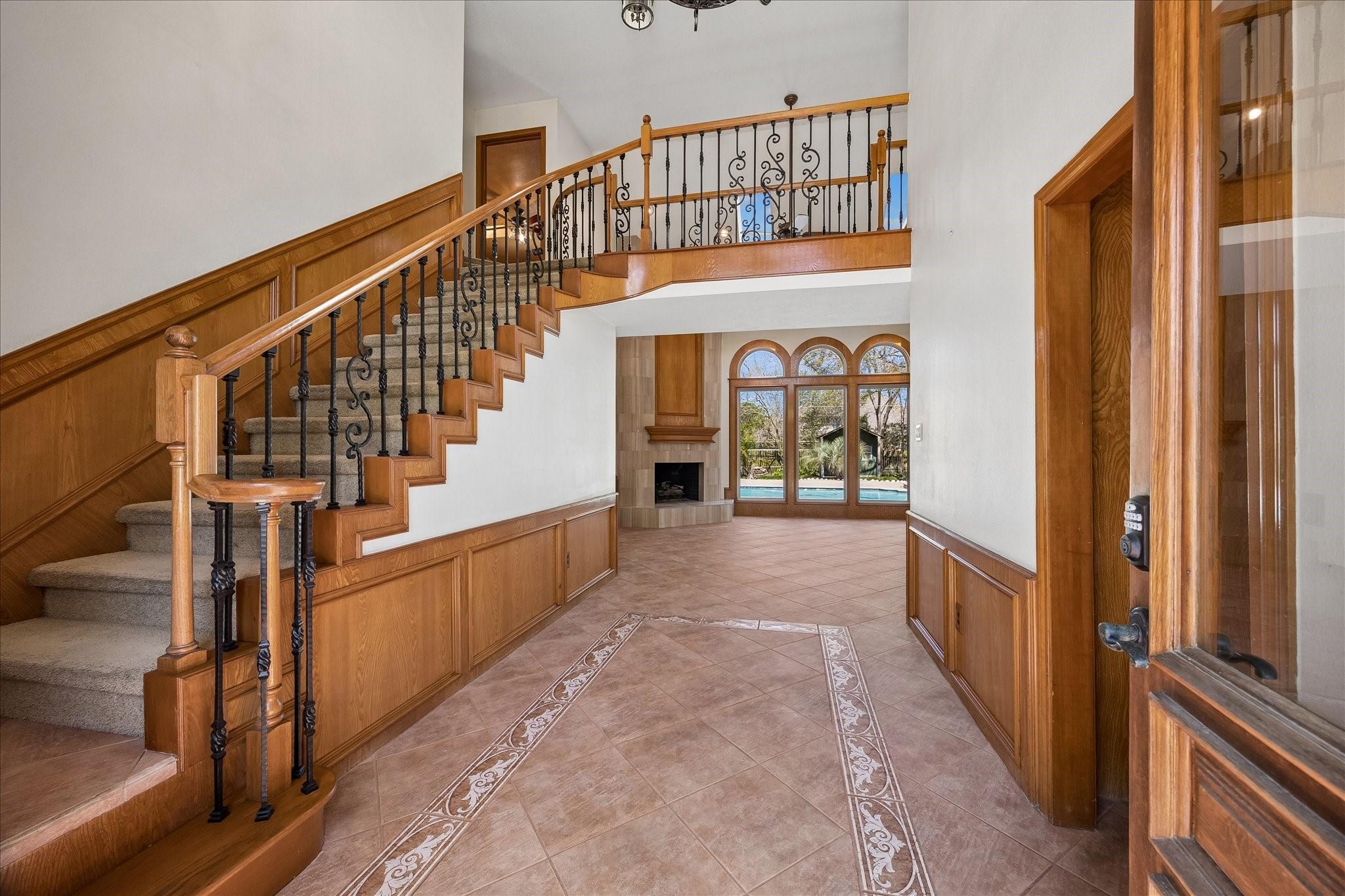 Image 4: Stunning front entry with tile and wrought iron sp