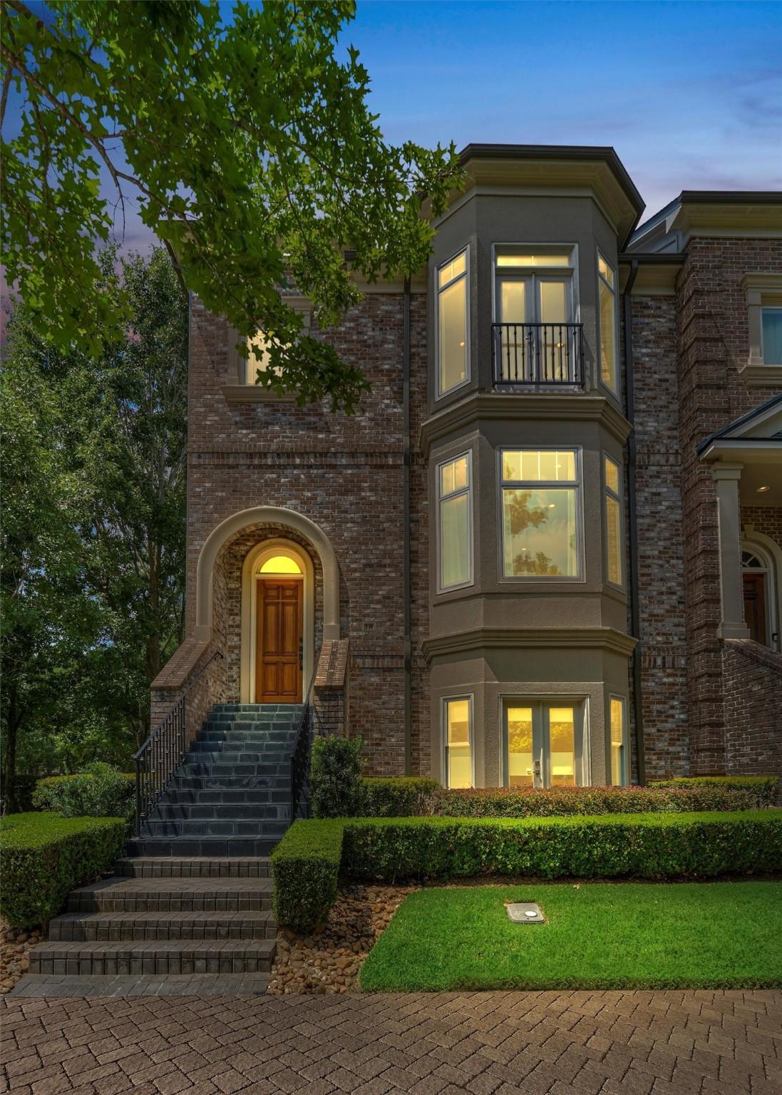 Image 3: A stunning twilight view of this corner brownstone