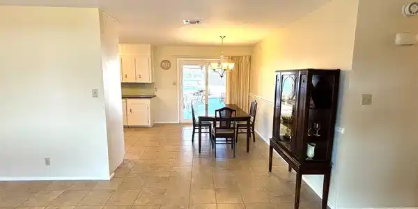 Image 4: Living Room looking into Dining area.