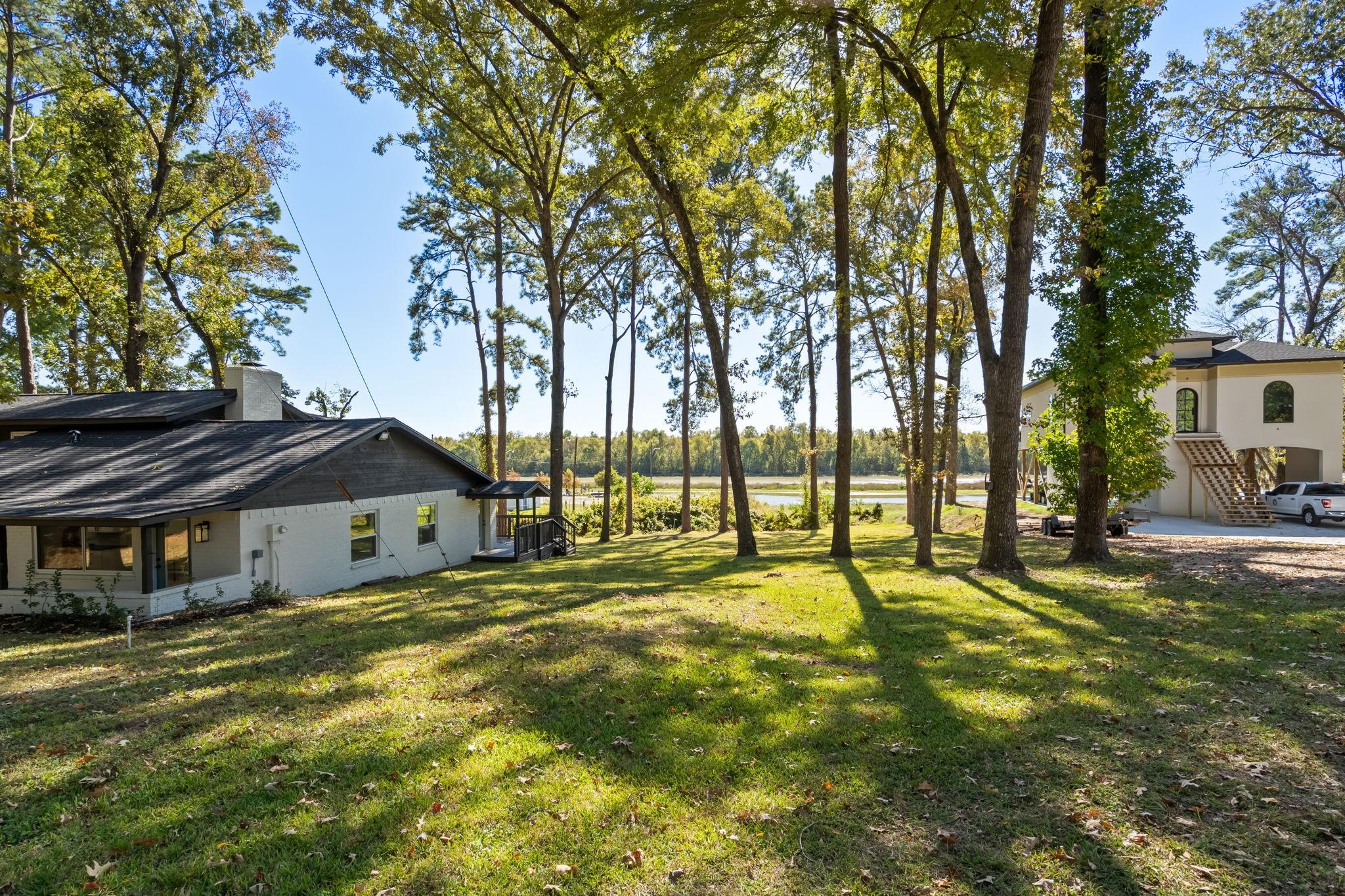 Image 1: This vacant sits adjacent to 284 Hackberry St., wh