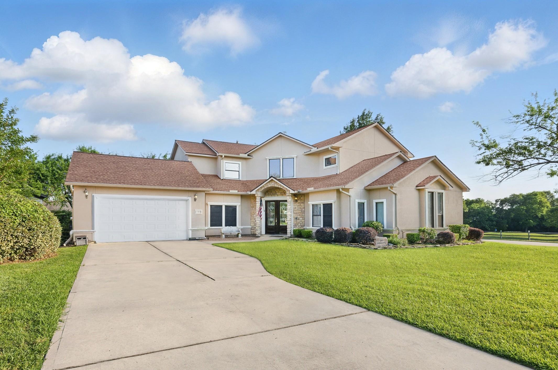 Image 1: This spacious two-story home features a well-maint