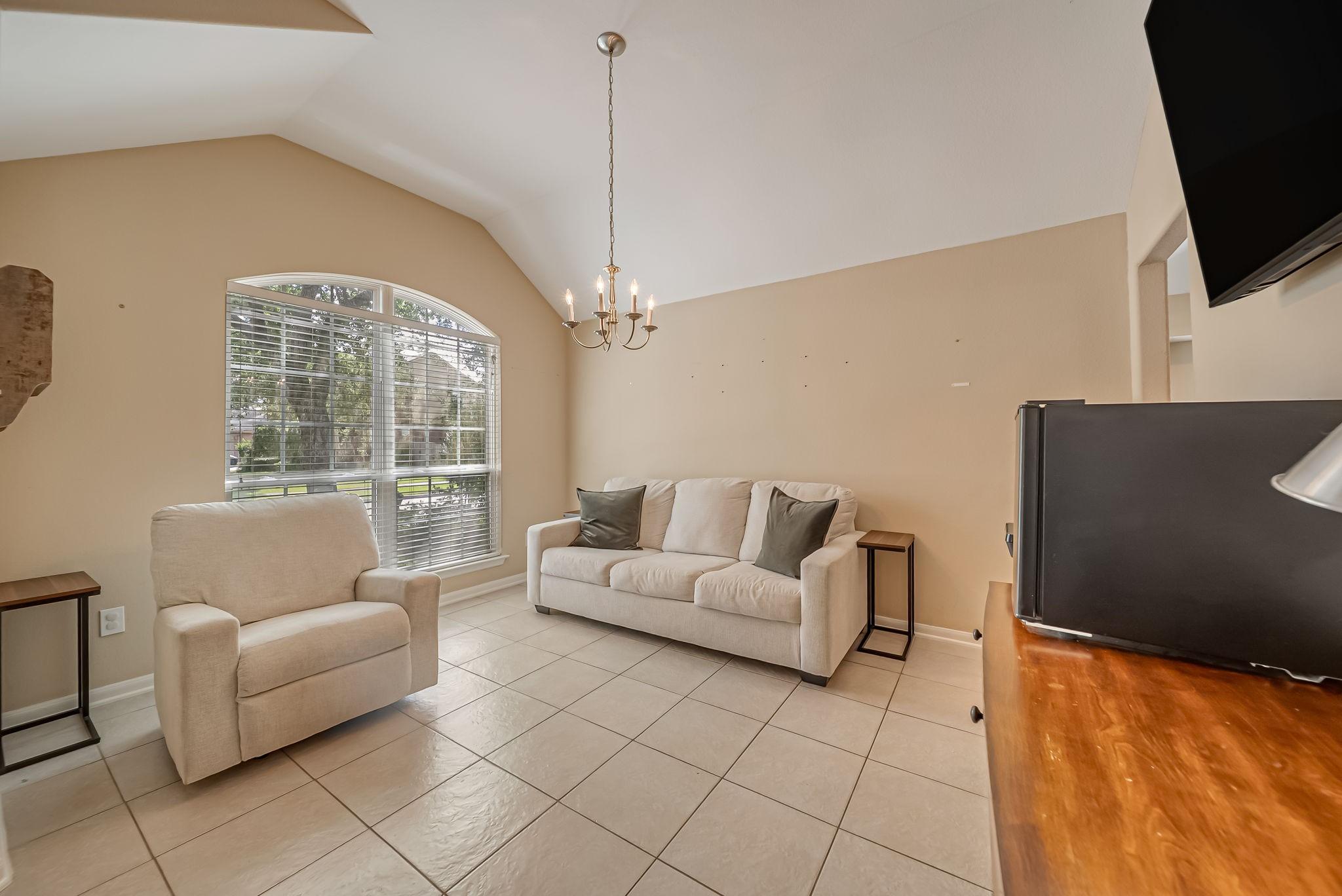 Image 4: Formal dining looking out to front of the house.