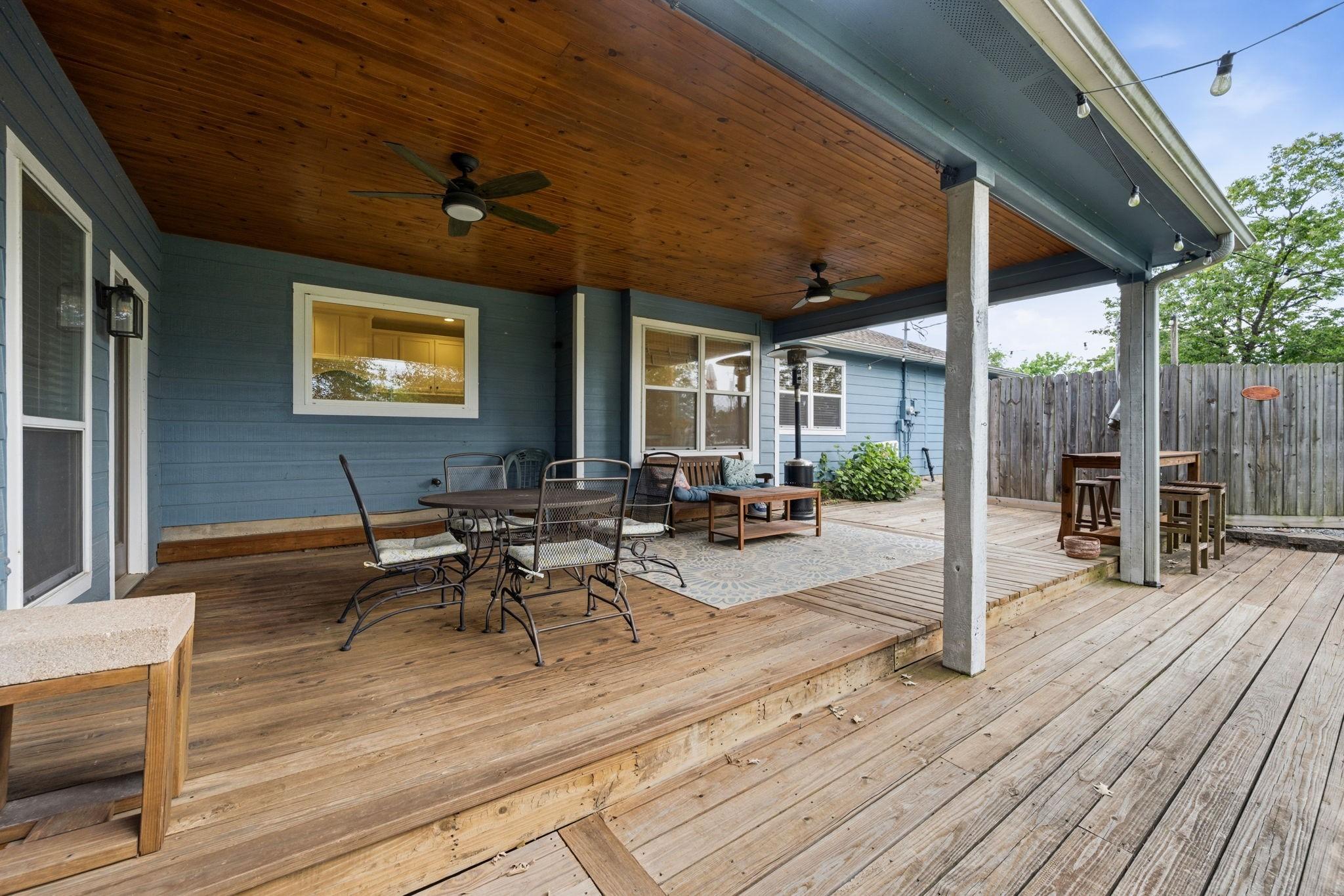 Image 4: One of two covered decks overlooking the back yard