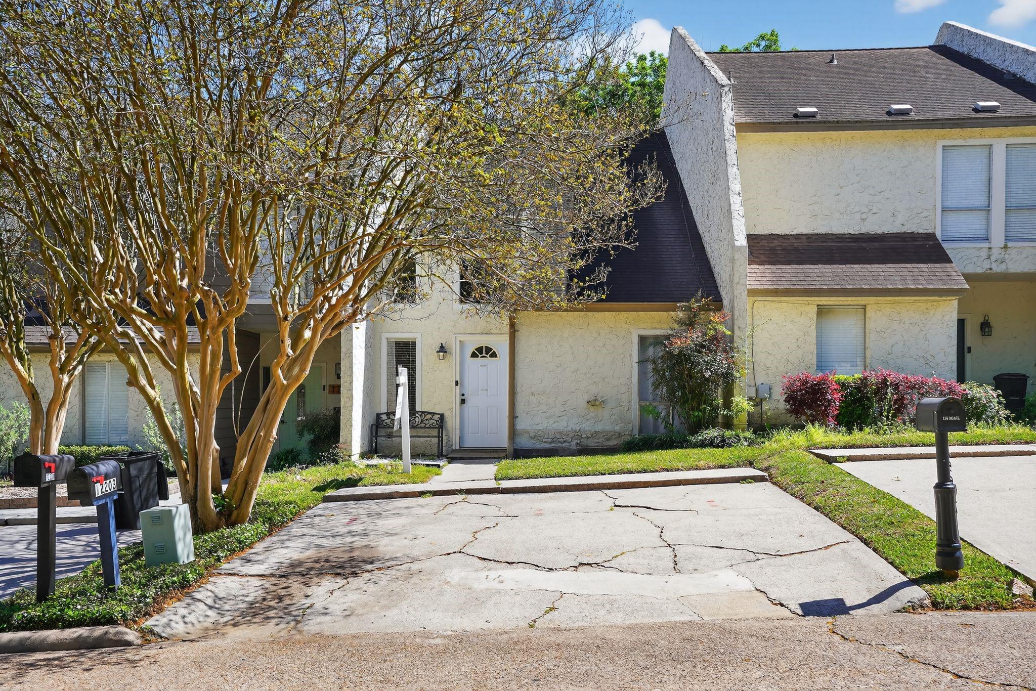 Image 3: A spacious driveway leading into the home.