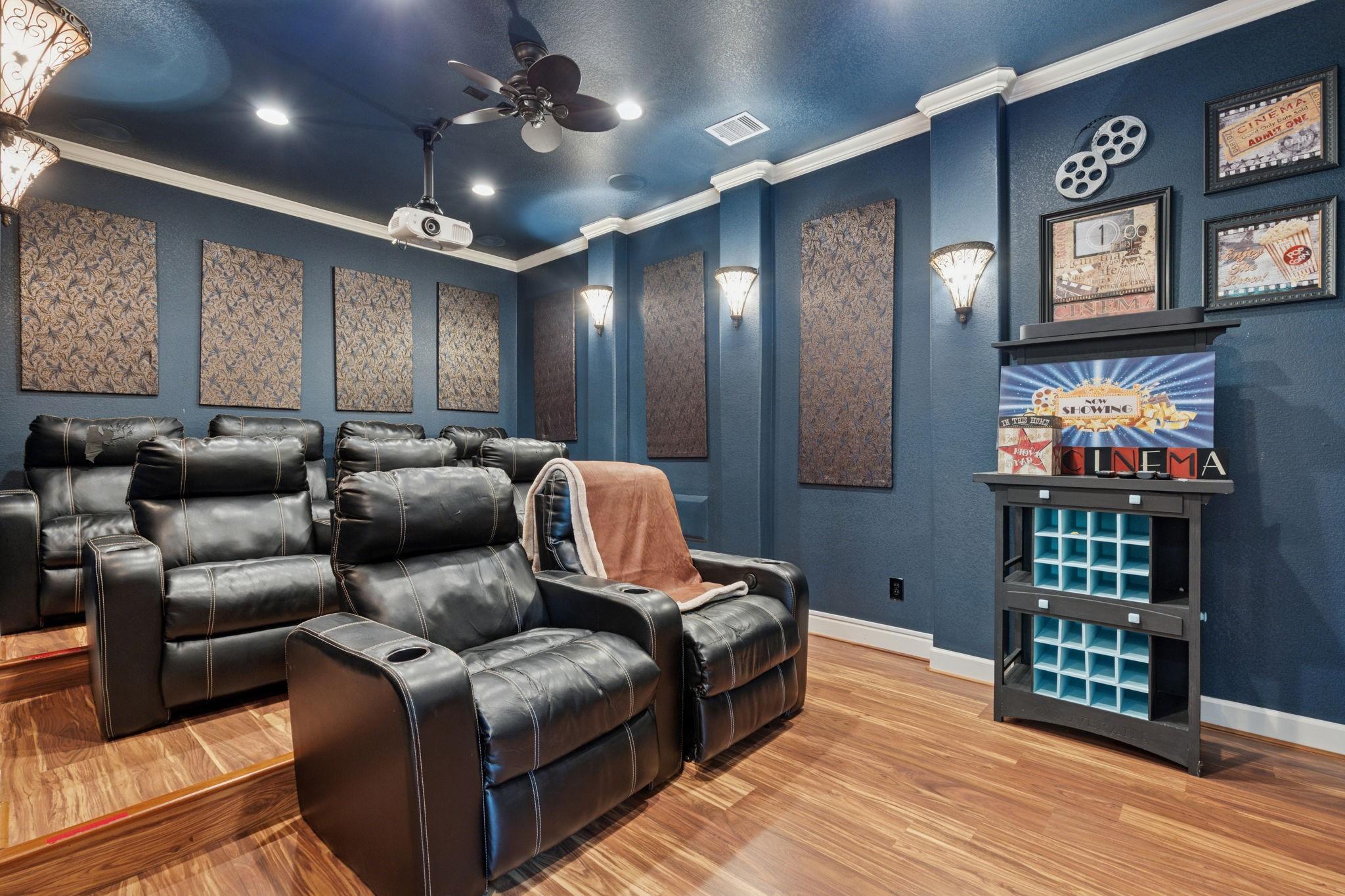 Image 4: The spacious media room, located just off the upst