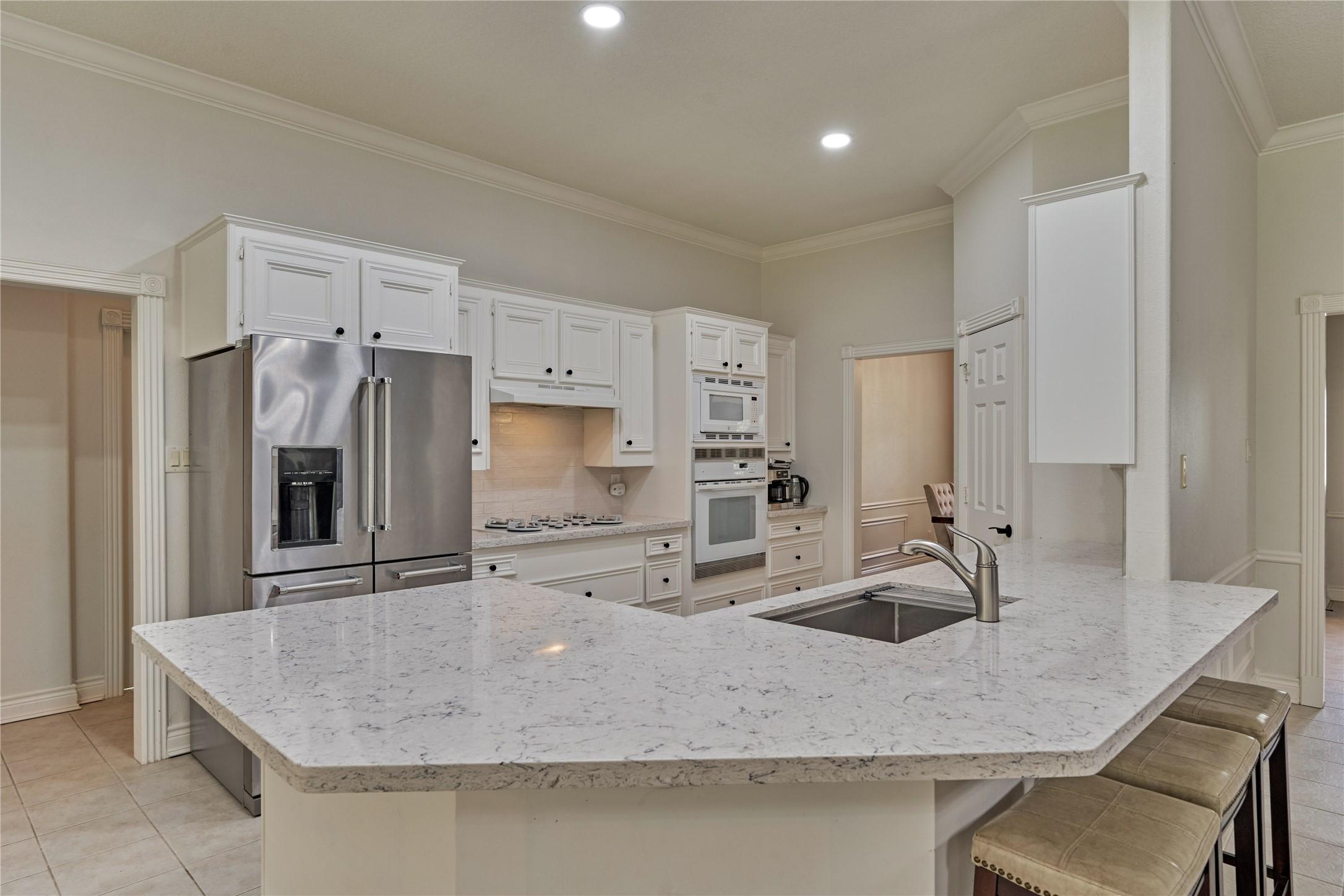 Image 4: There is plenty of countertop space and cabinet st