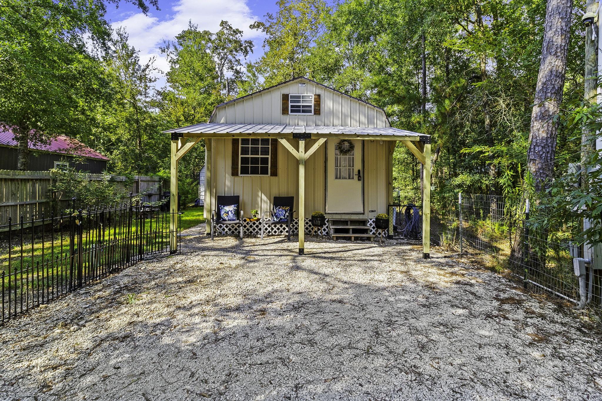 Image 4: A welcoming new porch invites you to slow down, si