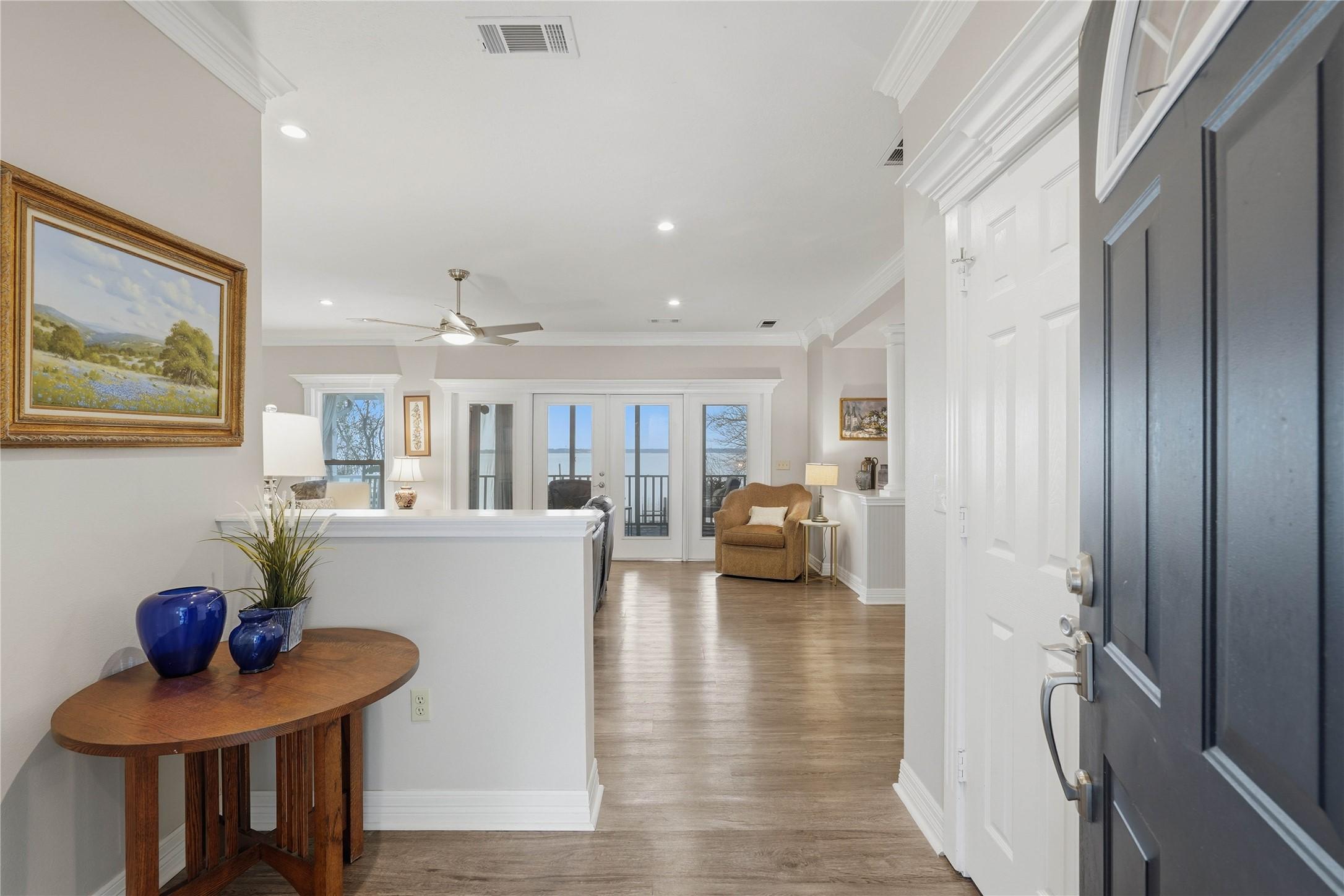Image 4: Entryway with convenient coat closet, leading into