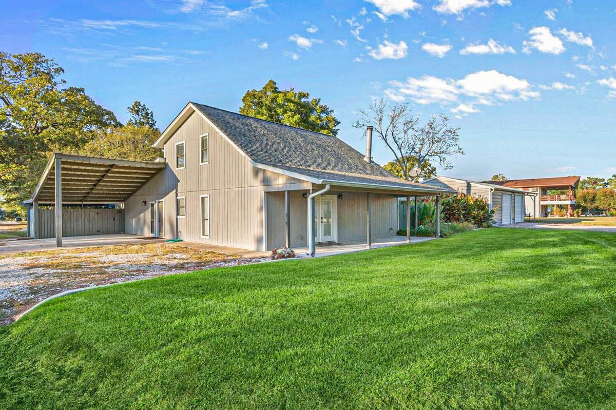 Image 1: Situated on a corner lot with a 21x20 carport, ext