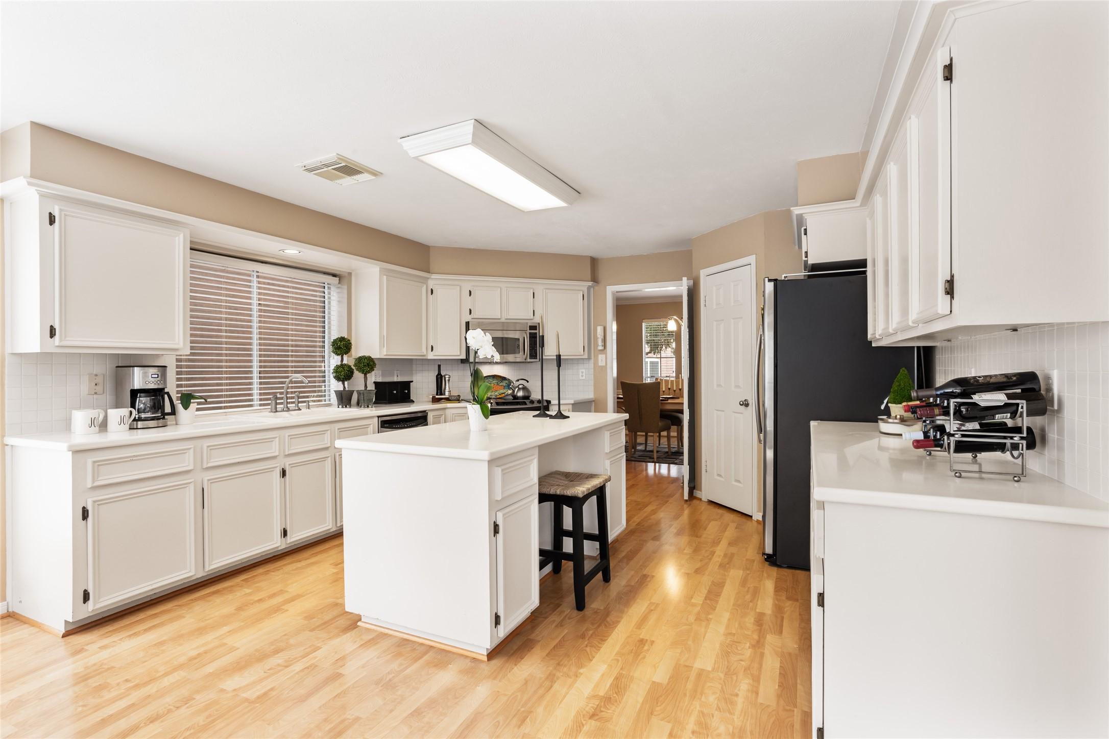 Image 2: This bright kitchen is the heart of the home.