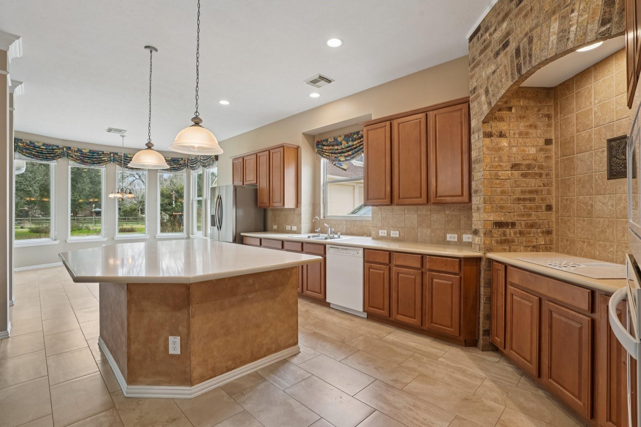 Image 3: Kitchen with generous island/breakfast bar