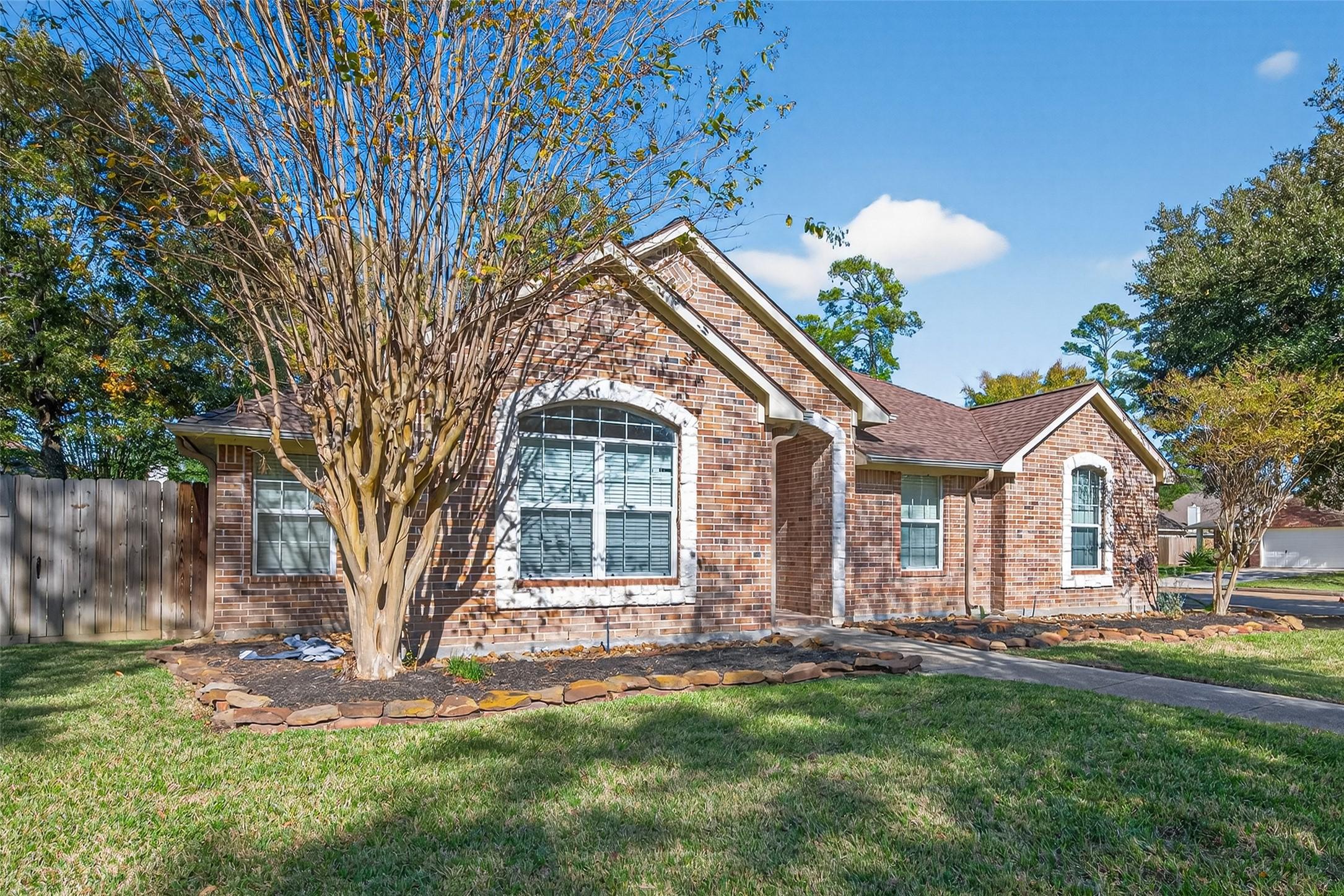 Image 2: Single-story brick home, perfectly positioned just