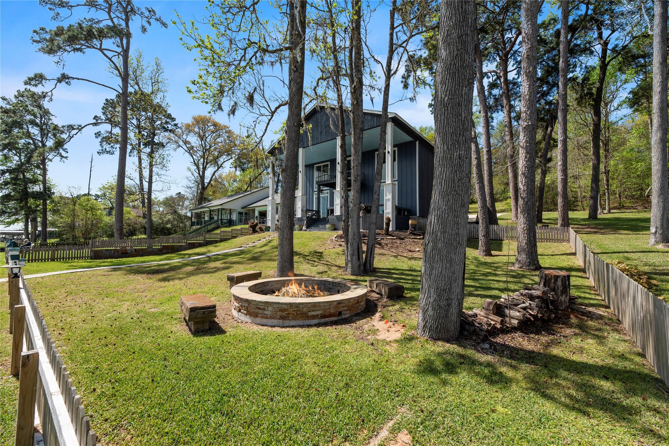 Image 2: This gorgeous two-story home, nestled among tall t