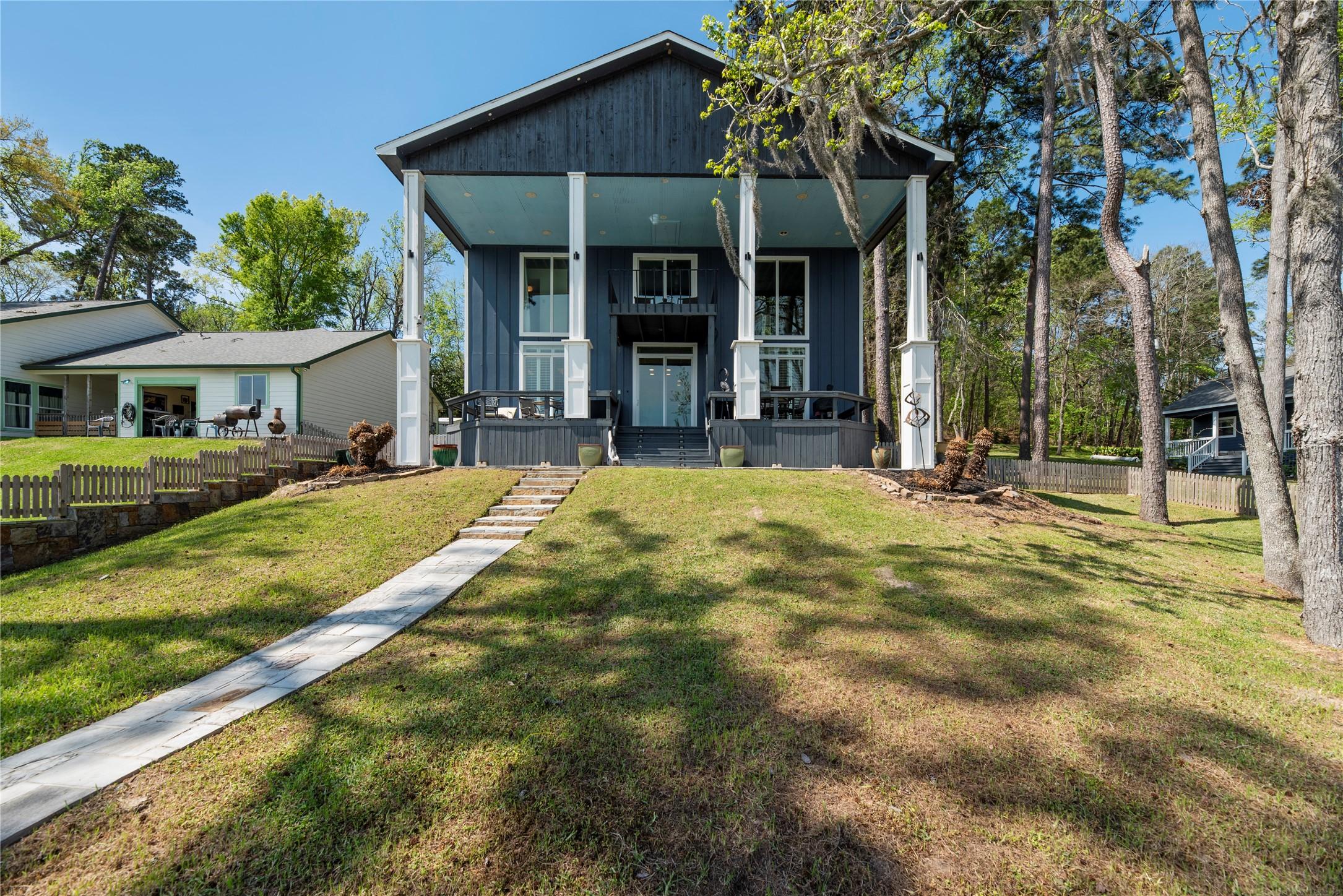 Image 3: Modern style two-story home, featuring a striking