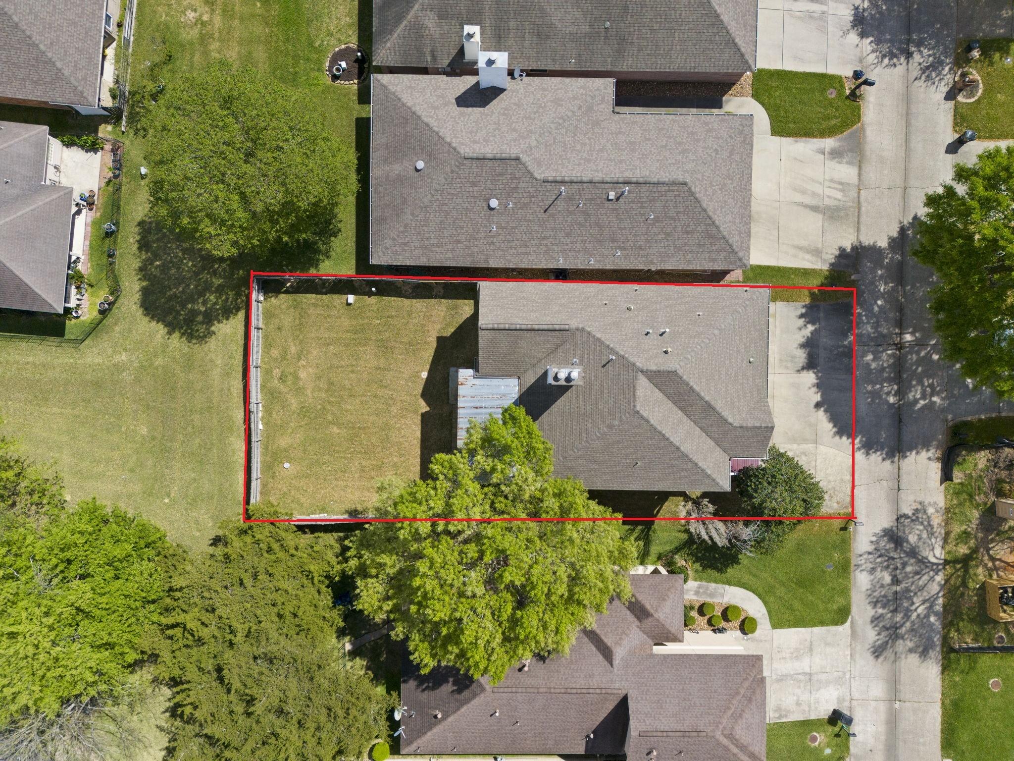 Image 2: This aerial view showcases the 6,229 sqft Lot with