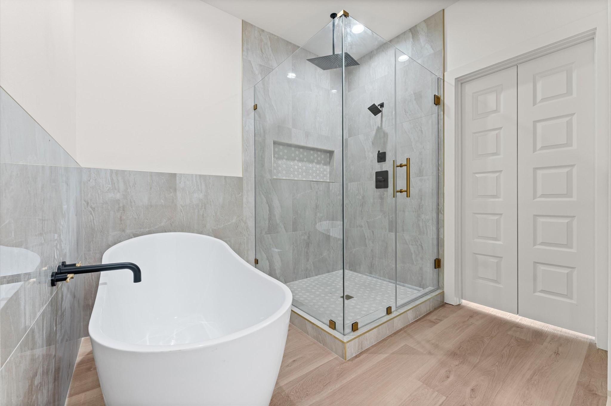 Image 3: The primary bath is full of options including dual