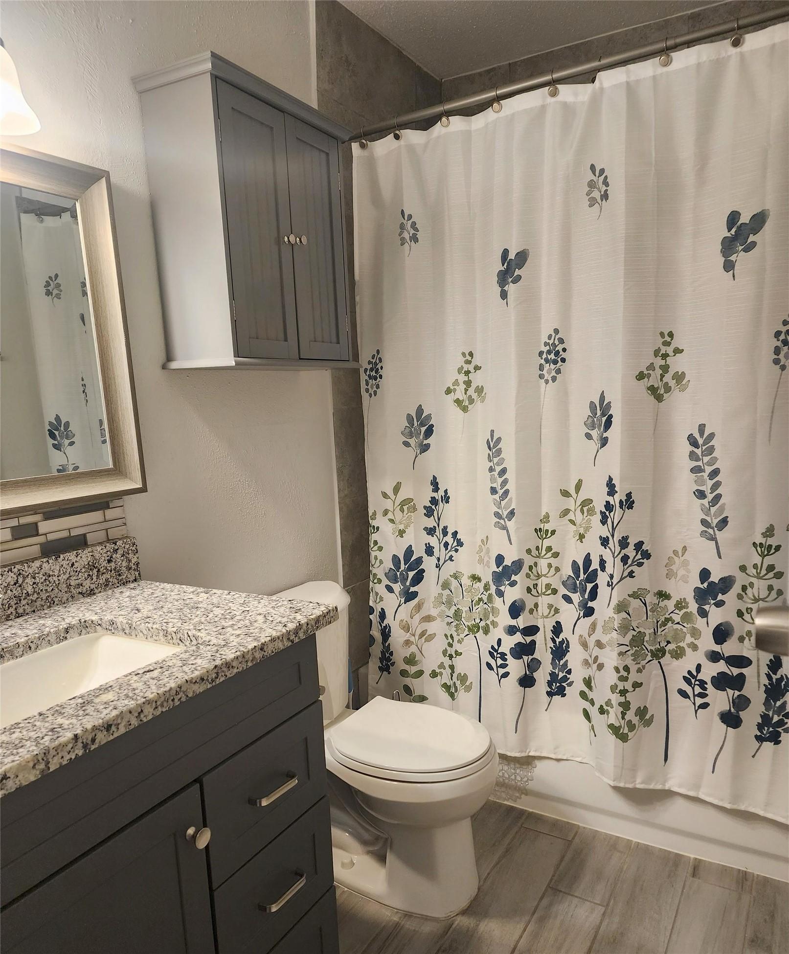 Image 3: The bathroom with granite counter tops and a wonde