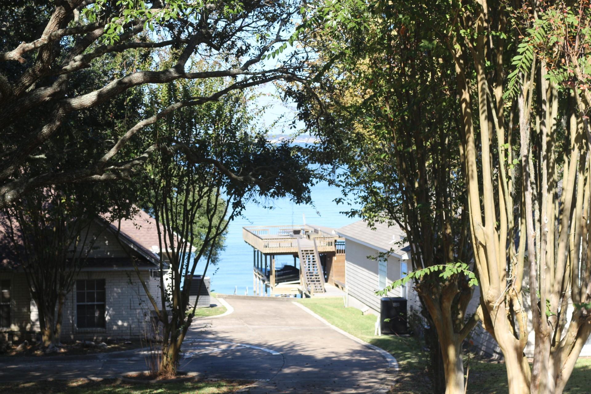 Image 1: This photo showcases a serene lakeside setting wit