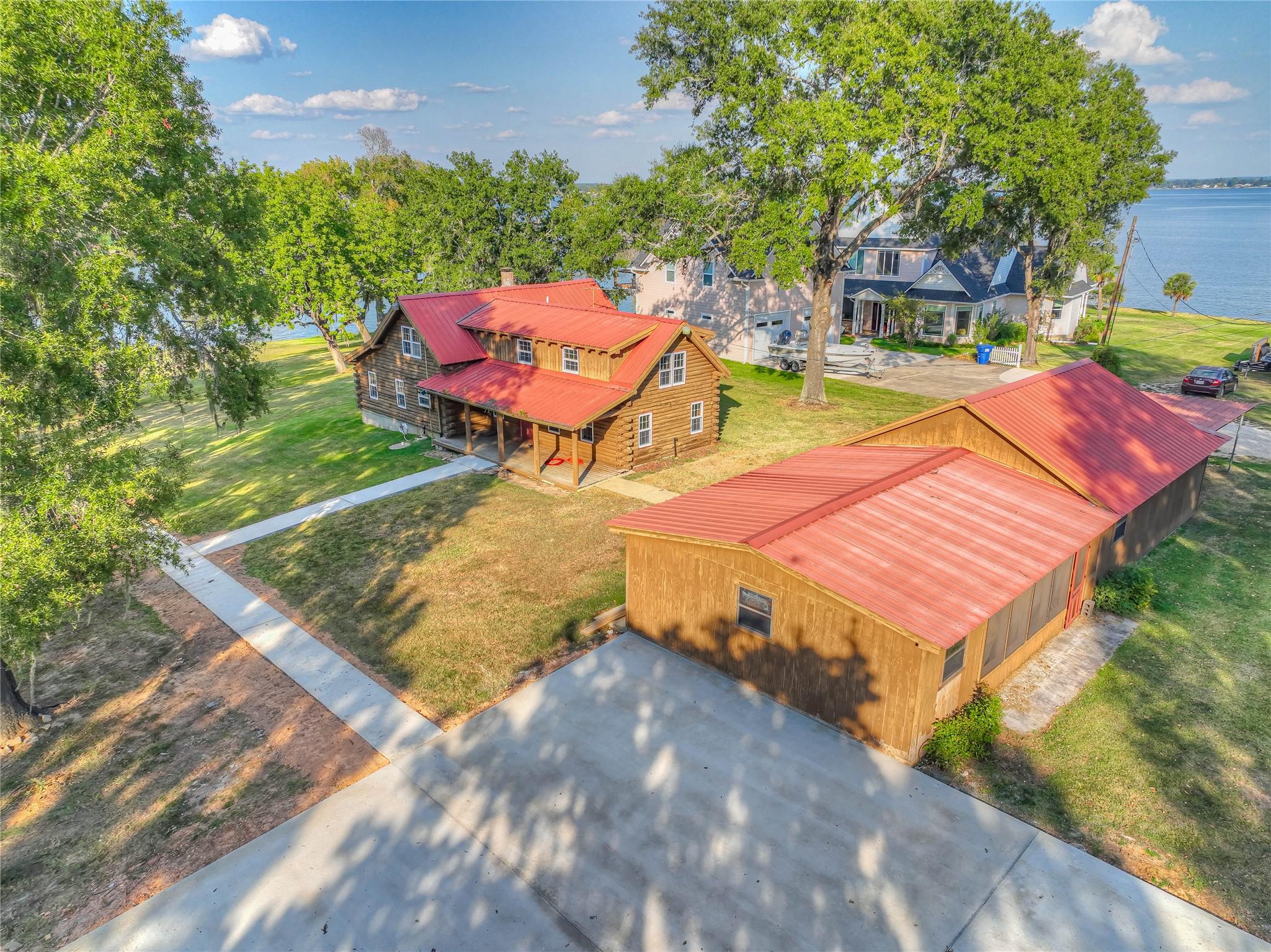 Image 3: AERIAL VIEW OF HOME, OUTSIDE KITCHEN, 2 CAR GARAGE
