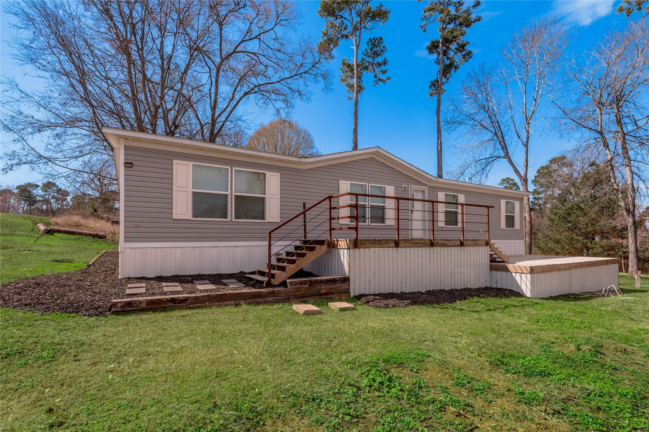 Image 1: Front view of this beautiful home. You can sit out