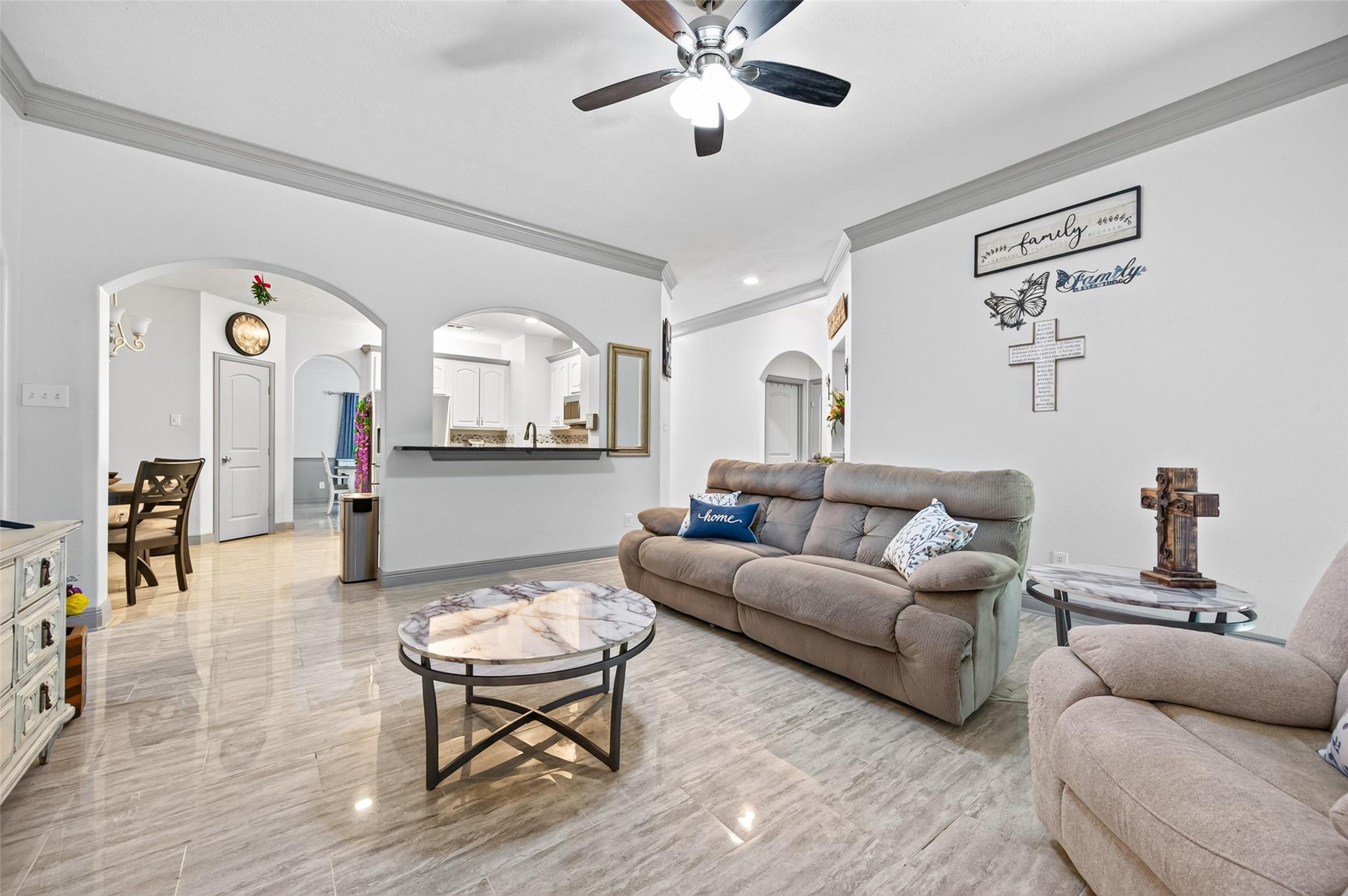 Image 1: Upgraded polished tile floors throughout the home
