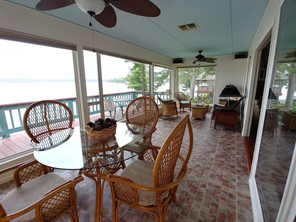 Image 1: Sunroom facing the water.