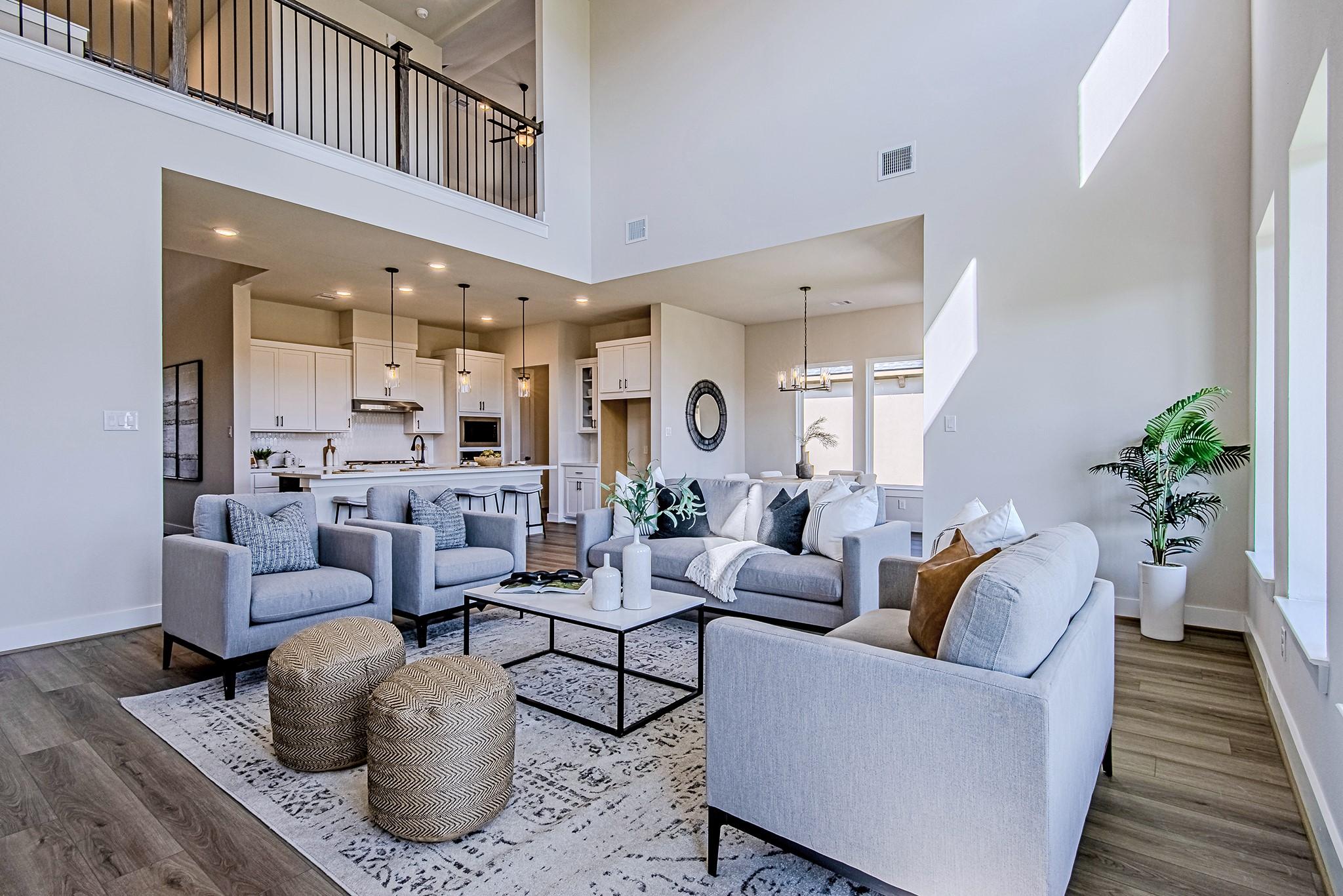 Image 2: Open living room with high ceilings and a seamless