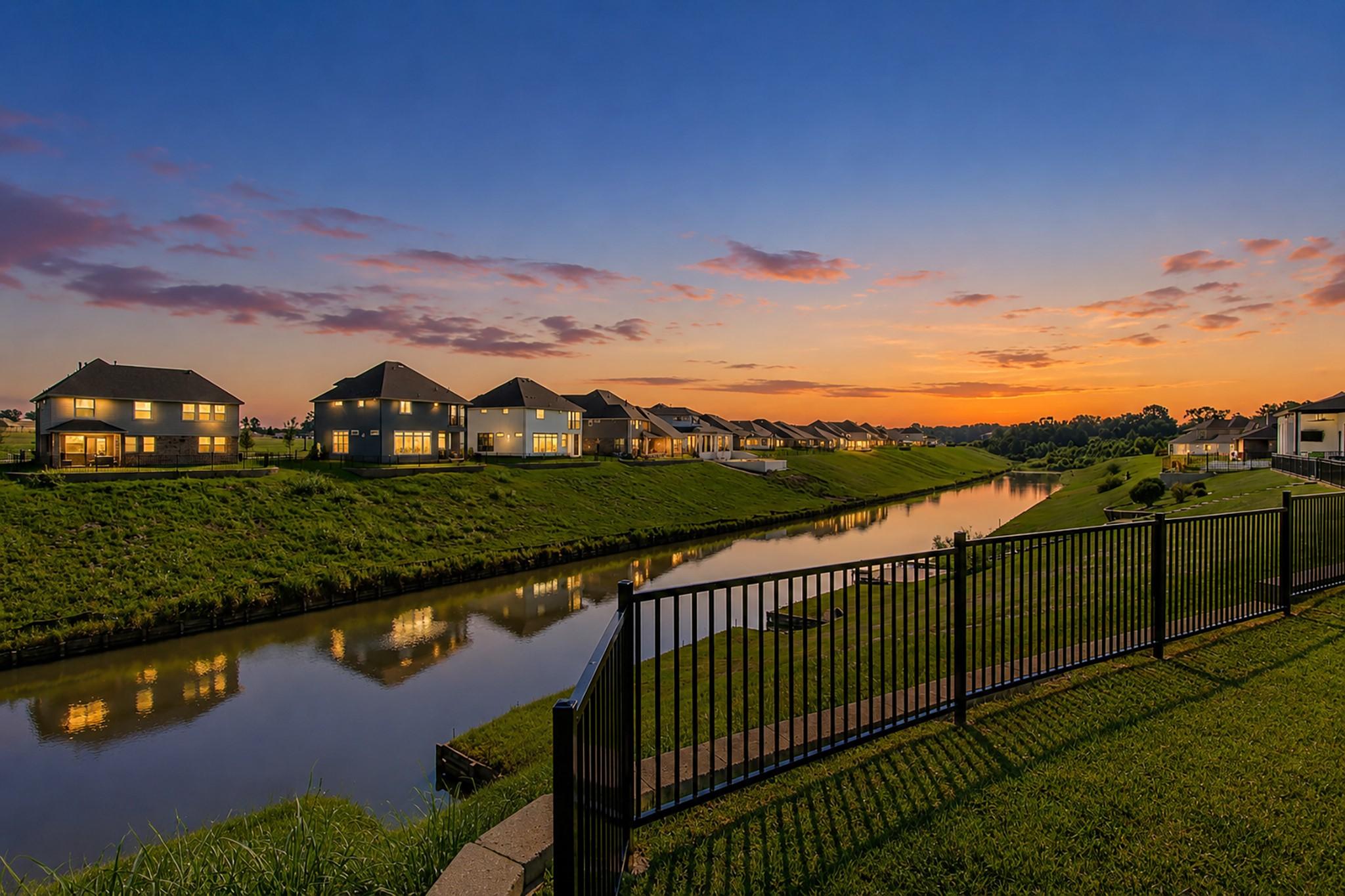 Image 4: Peaceful sunset view of the waterway directly behi