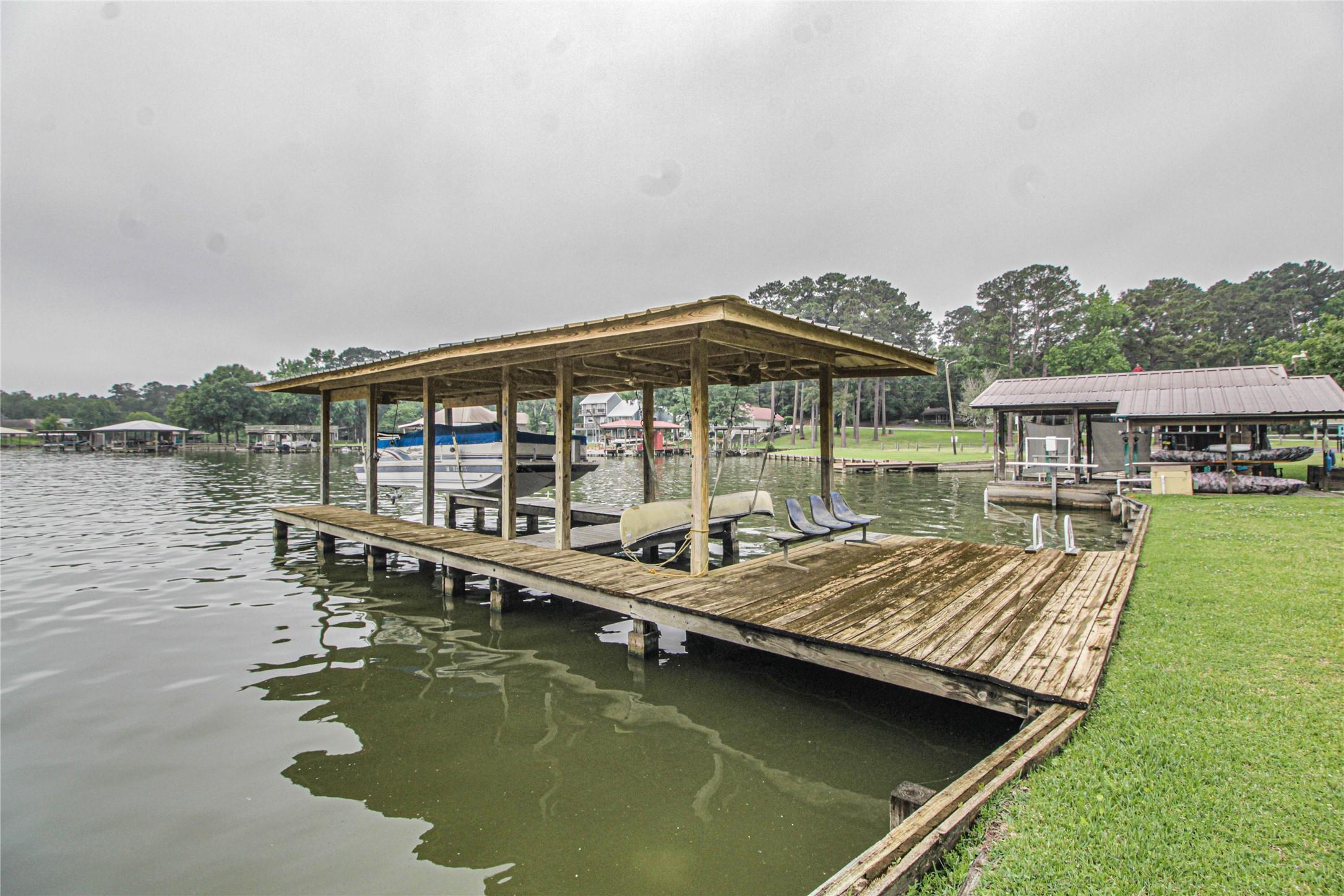 Image 1: Own your own lakefront property with a wooden dock