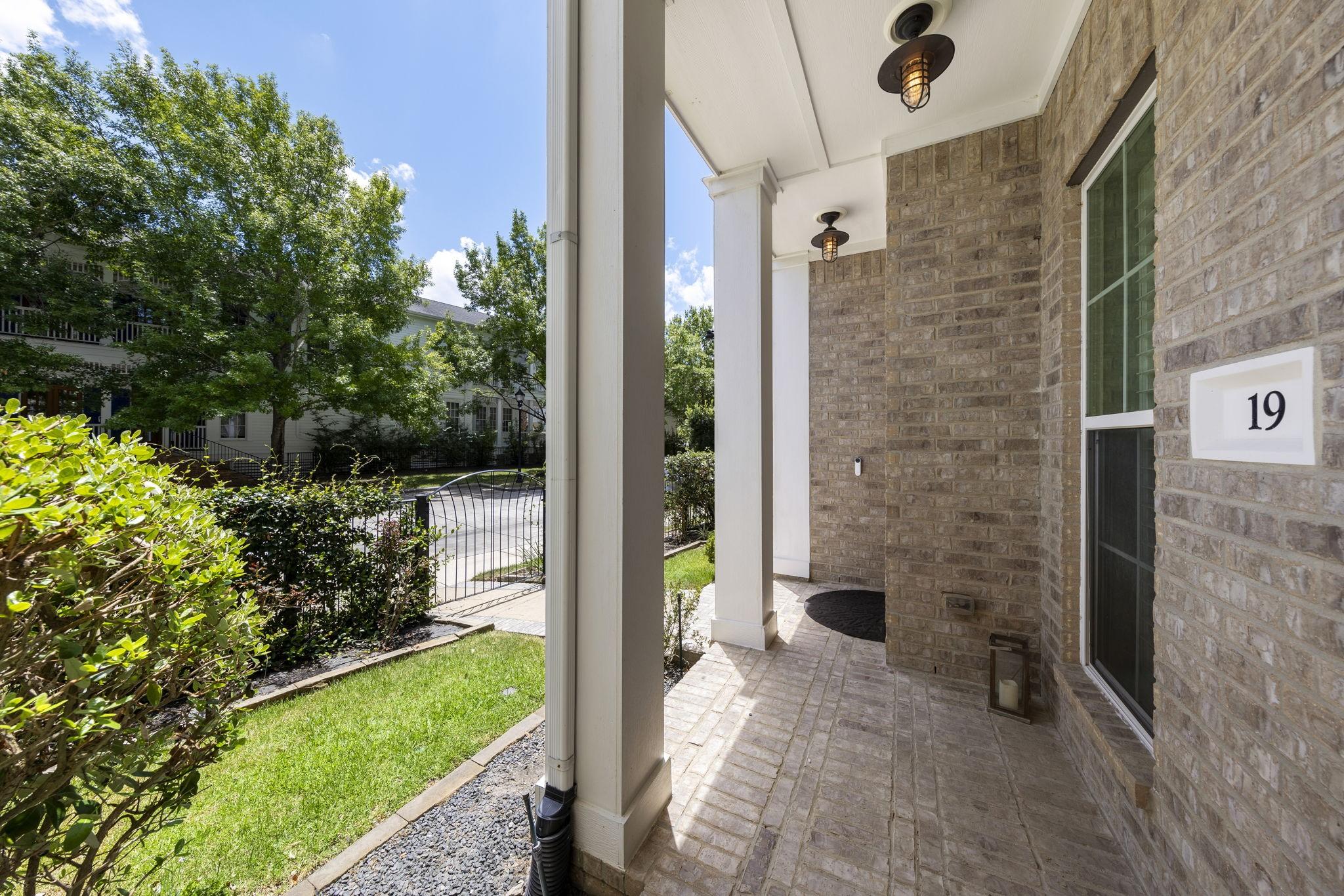 Image 3: The inviting covered front porch offers a peaceful
