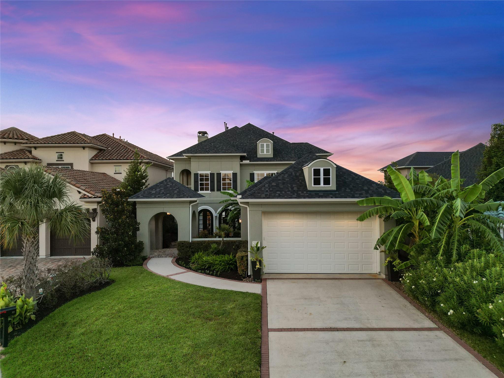 Image 3: Extra long driveway leads to your 10' tall garage