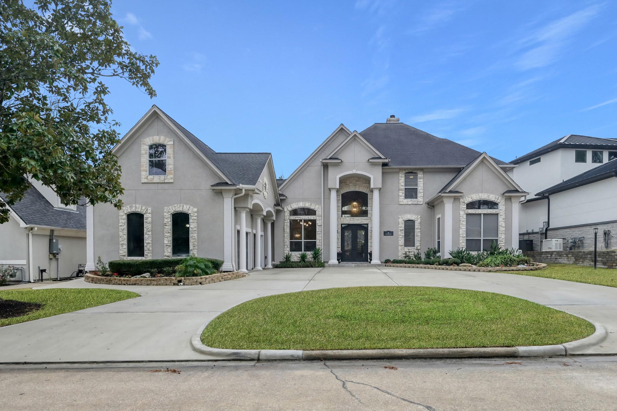 Image 1: Full front elevation featuring symmetrical design,