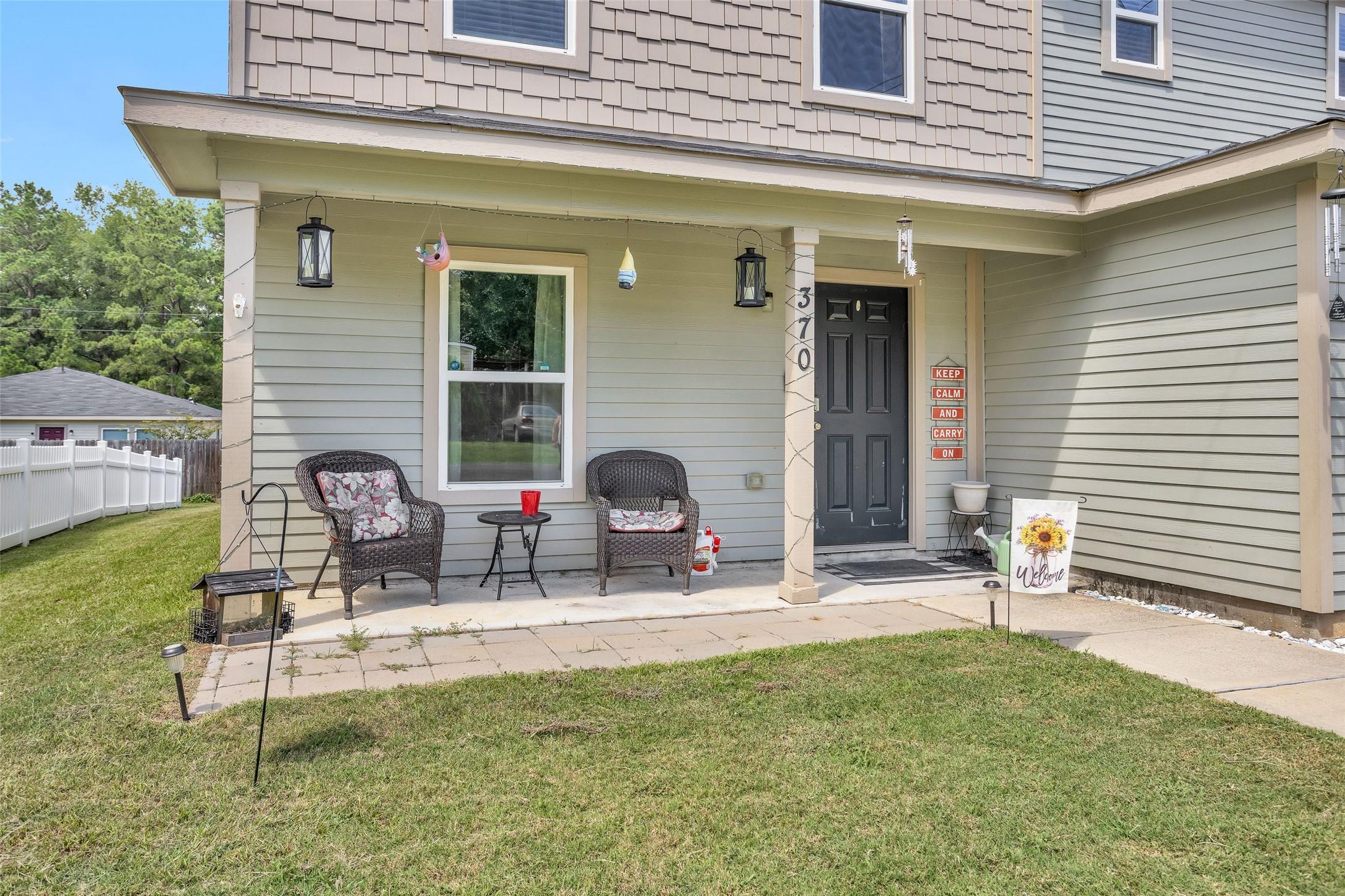 Image 4: Covered front porch perfect for sipping your morni